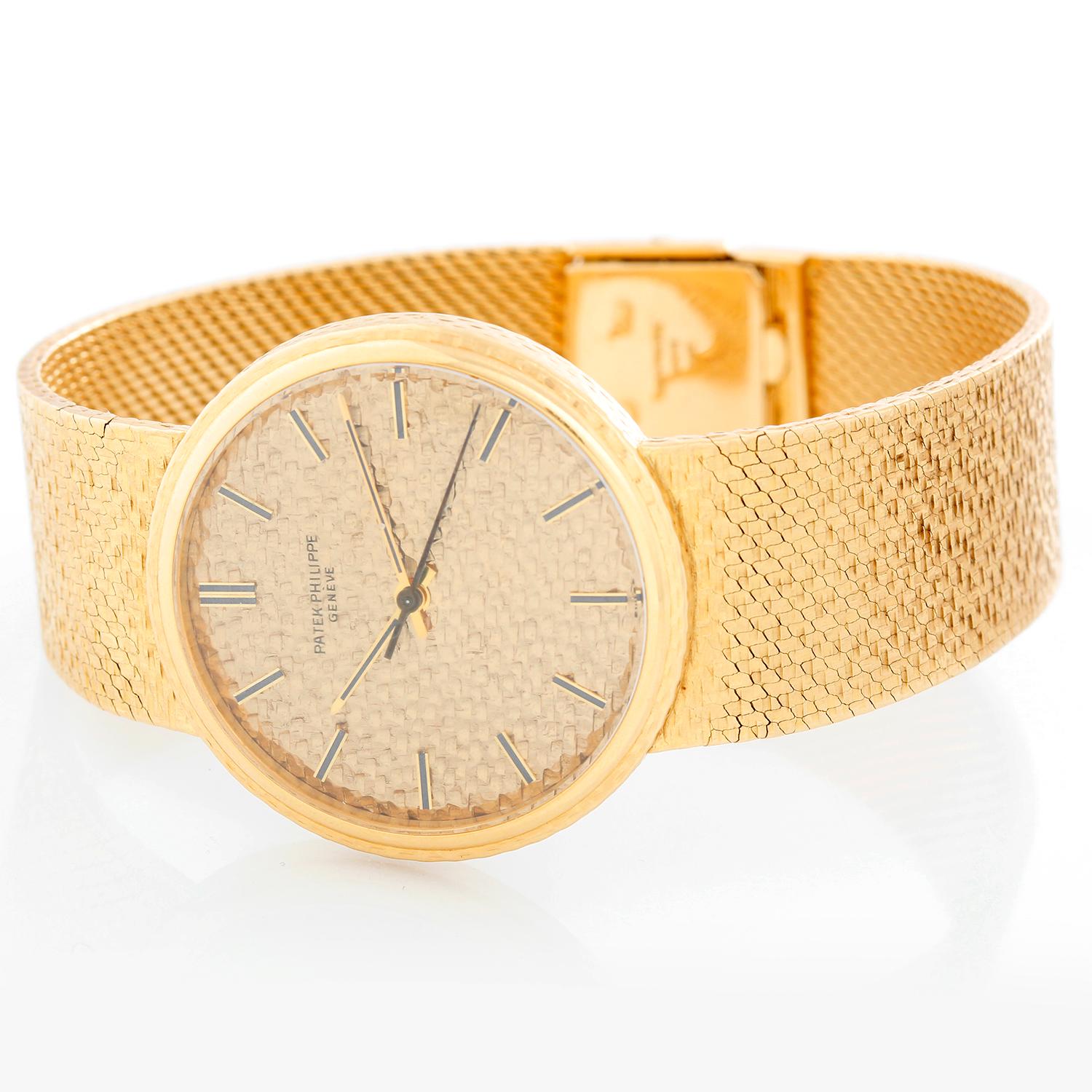 Patek Philippe & Co. 18K Yellow Gold Calatrava 3563 / 002 J - Manual. 18K Yellow Gold textured with smooth bezel ( 34 mm). Gold textured dial with yellow gold hour markers. 19K Yellow Gold Patek Philippe bracelet; will fit up to a 7 3/4 inch wrist .