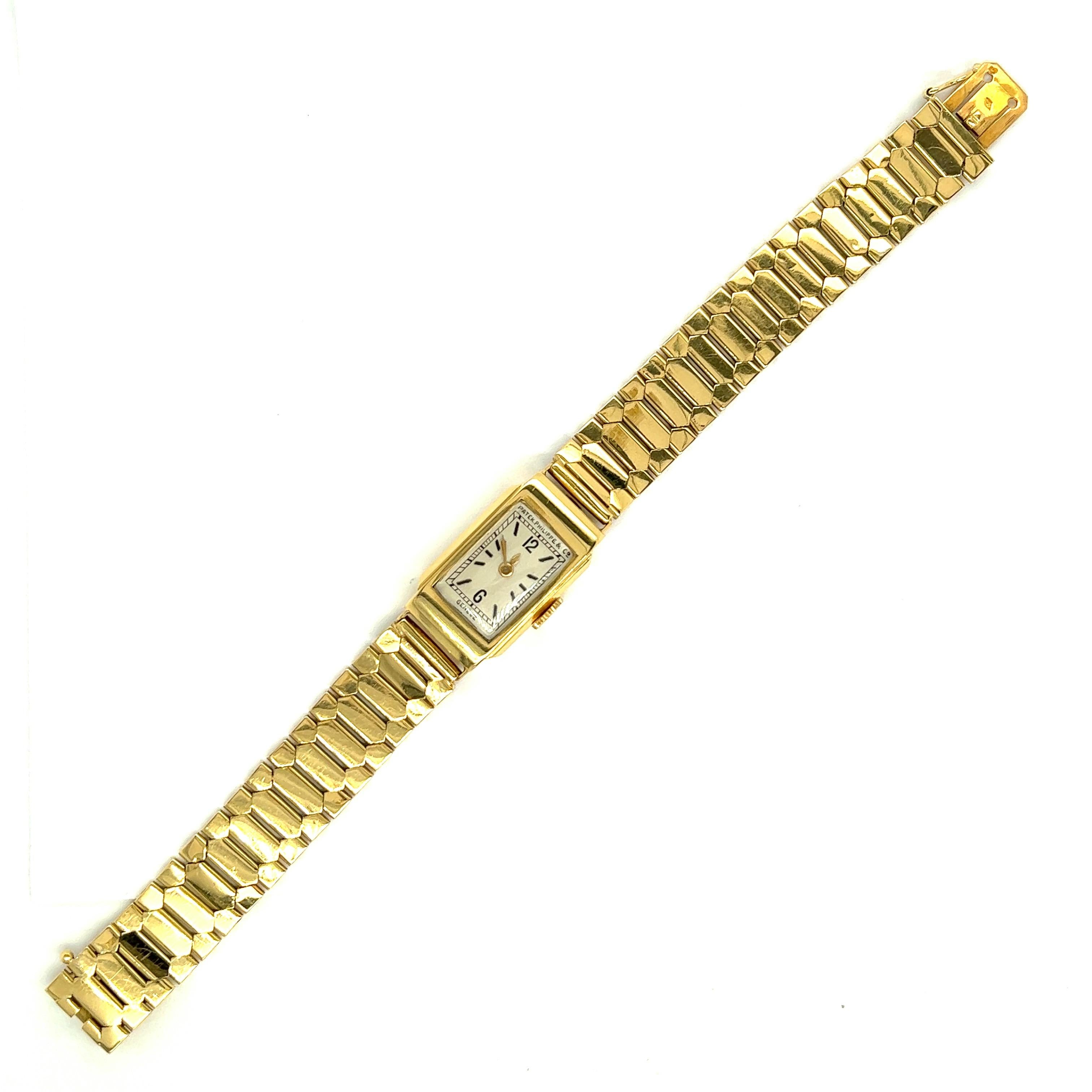 Patek Philippe & Co. Genéve Yellow Gold Lady's Wristwatch

A Patek Philippe & Co. lady's wristwatch made of yellow gold, featuring a rectangular-shaped case with 12 and 6 for time and black lines to represent other hours; the straps present a