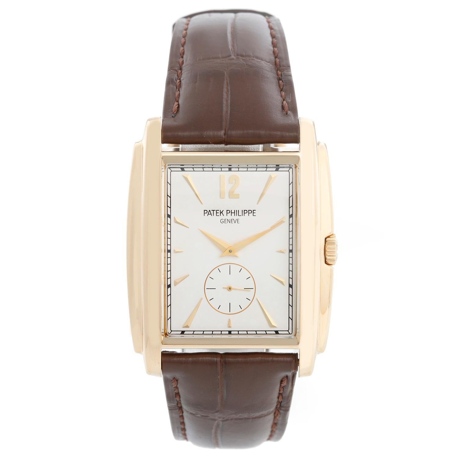 Patek Philippe & Co. Gondolo 18k Yellow  Gold Mens Watch 5124J - Manual winding. 18k yellow gold case (33mm x 43mm). Silver dial with stick hour markers. New brown Patek Philippe strap band with 18k yellow gold buckle. Pre-owned  with Patek travel