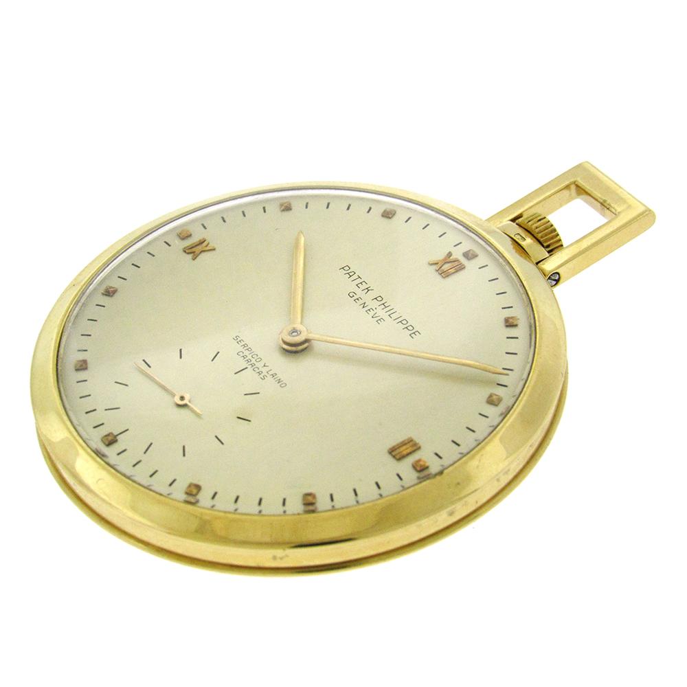 18K yellow gold Patek Philippe & Co open face pocket watch made circa 1950 for Serpico & Laino is a 45mm crisp pocket watch with concave bezel, polished unengraved back, matte silvered dial with applied Roman numeral quarter hours and pyramidal hour