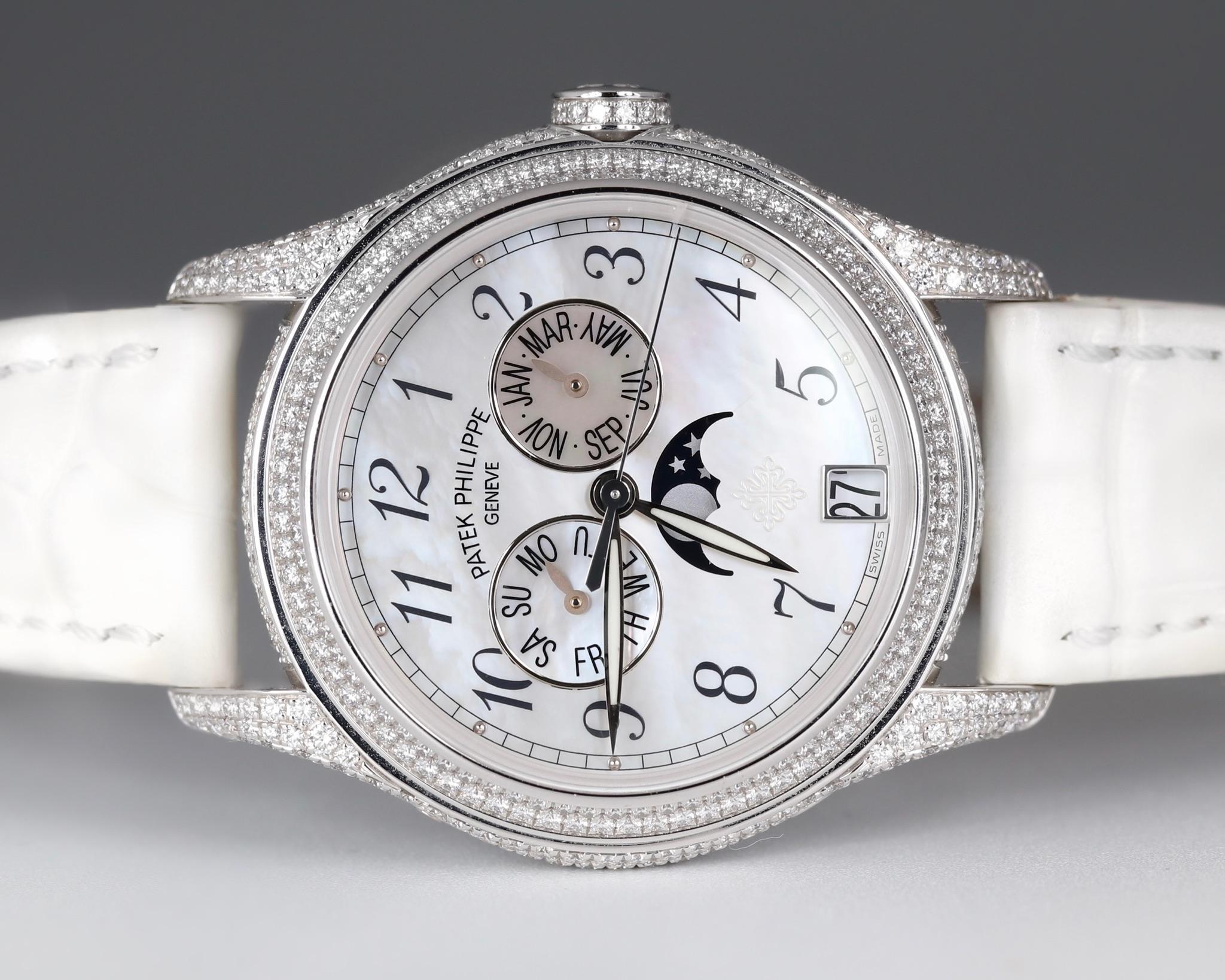 Unwornwatches presents Patek Philippe Complications Dress Watch, with the Model Number: 4937G-001, has a White Gold 37 mm Round Case with Screw Down Crown and a Factory Diamonds Bezel. This Ladies Patek Philippe Complications has an attractive White