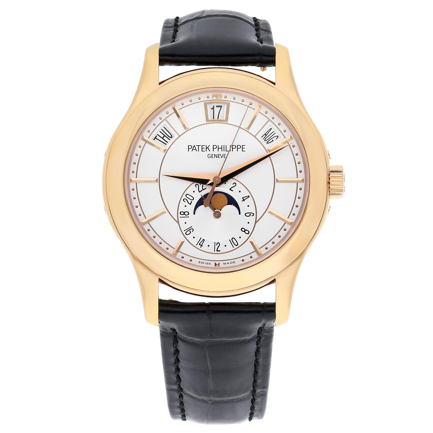 This beautiful Patek Philippe Annual Calendar 5205R-001 watch is in great condition. It has a 40mm rose gold case, a silver dial with rose gold markers, an annual calendar, moon phases, and fitted on a black alligator strap with a rose gold buckle.