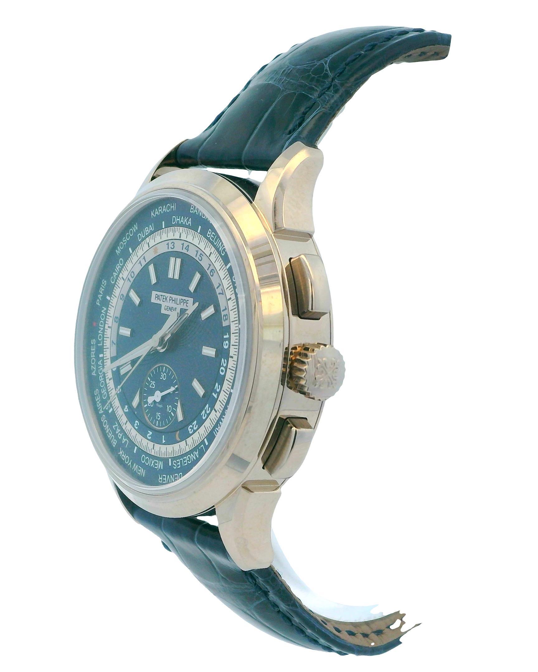 Patek Philippe World Time 5930G-010 Men's Watch This exquisite watch features a 39.5mm case made of 18K white gold, complemented by a smooth 18K white gold bezel. The striking blue dial showcases white gold hands and index hour markers. The inner