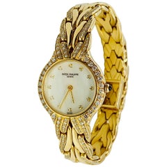 Patek Philippe Diamond and 18 Karat Yellow Gold La Flamme Ladies Watch