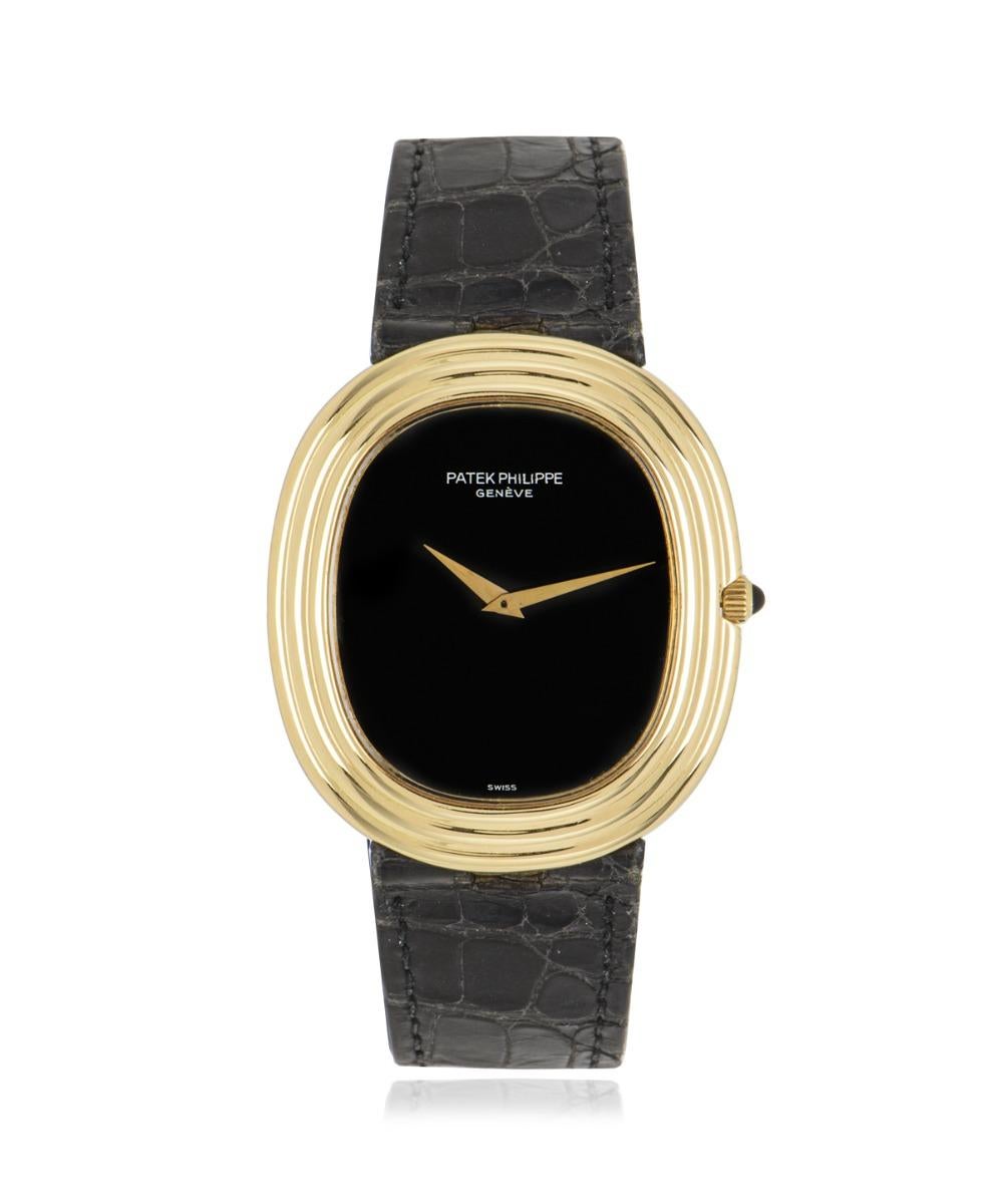 A yellow gold Elipse, 33mm by Patek Philippe. Featuring a distinctive black onyx dial with a fixed yellow gold bezel and a crown set with a single cabochon. Fitted with a self-winding automatic movement, sapphire crystal and a Patek Philippe black