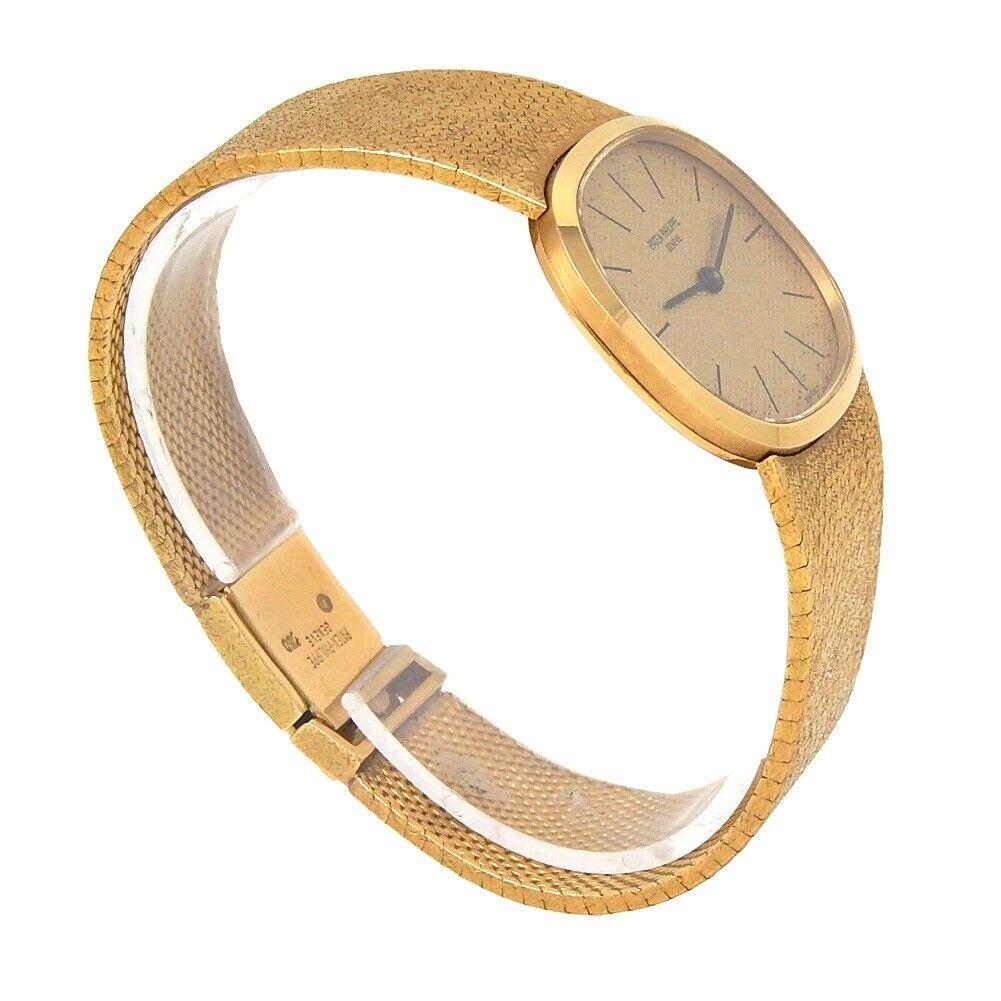 Brand: Patek Philippe
Band Color: Yellow Gold	
Gender:	Men's
Case Size: 24-27.5mm	
MPN: Does Not Apply
Lug Width: 21mm	
Features:	12-Hour Dial, Gold Bezel, No Hour Marks, Sapphire Crystal, Swiss Made, Swiss Movement
Style: Luxury	
Movement: