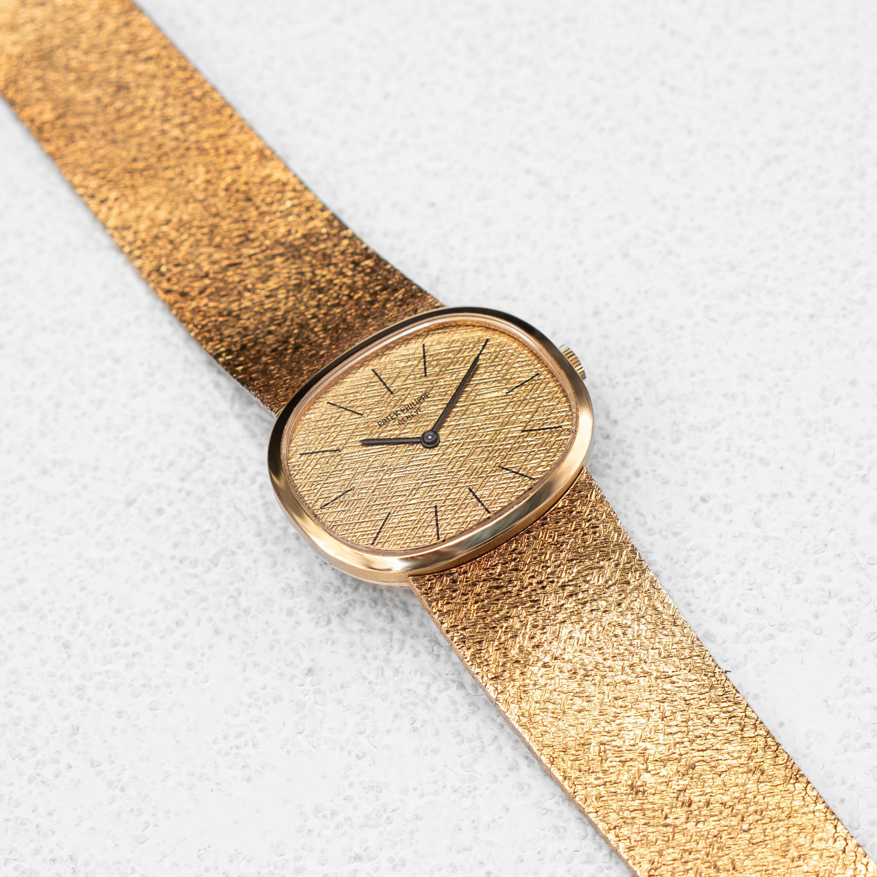 Reloj Patek Philippe Ellipse 3545 para caballero. Caja de 32,00 mm de oro amarillo de 18k. Bisel de oro amarillo de 18k. Esfera e índices horarios de color champán. Cristal de zafiro. Pulsera de malla con cierre de joya de oro amarillo de 18