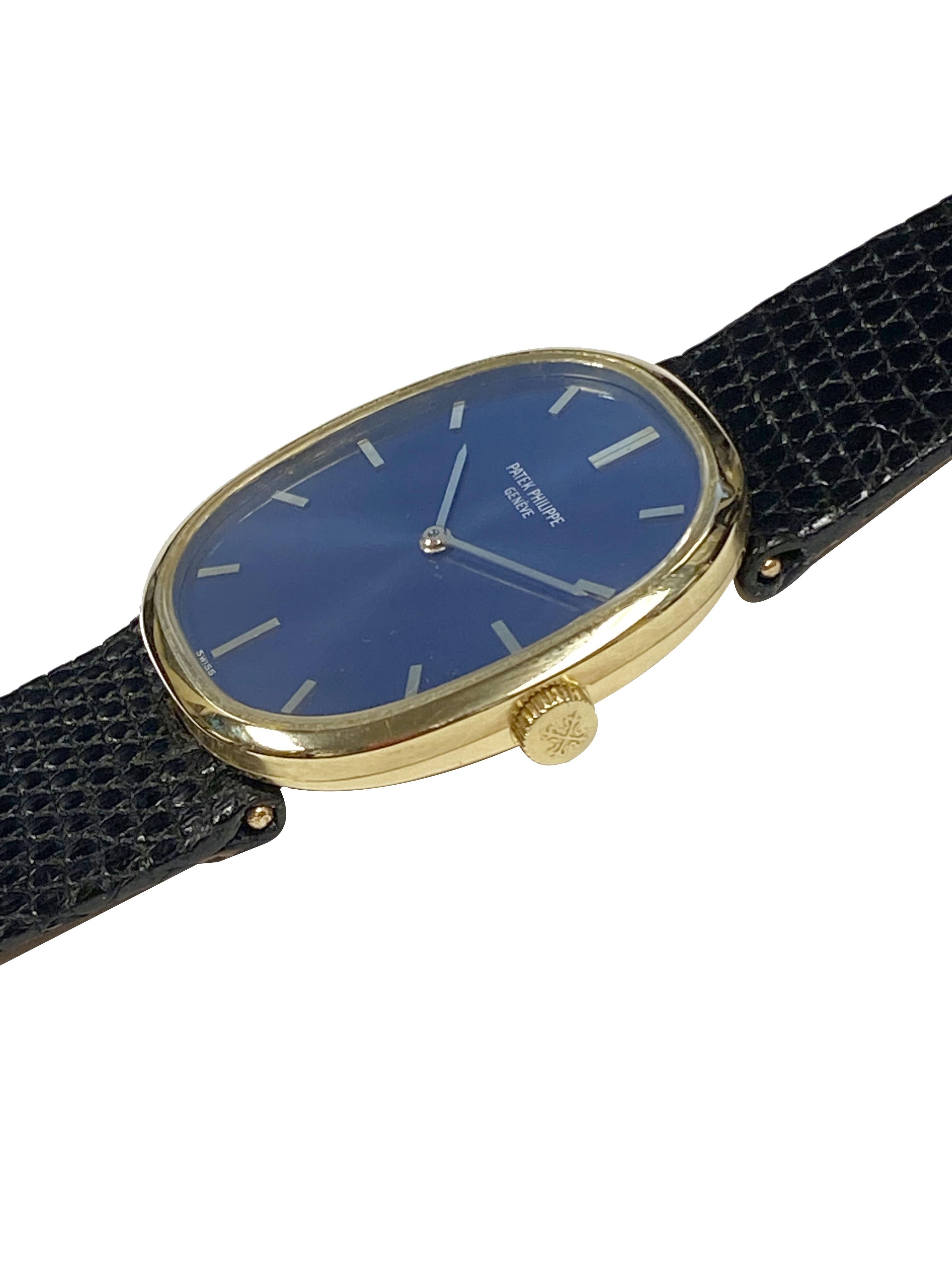 Circa 1990s Patek Philippe Reference 3548 Ellipse Wrist Watch,  32 X 27 M.M. 18K Yellow Gold 3 Piece case, Caliber 215, 18 Jewel, mechanical, manual wind movement. Blue Satin Dial with Raised Gold markers, Sapphire glass crystal, Patek Philipppe