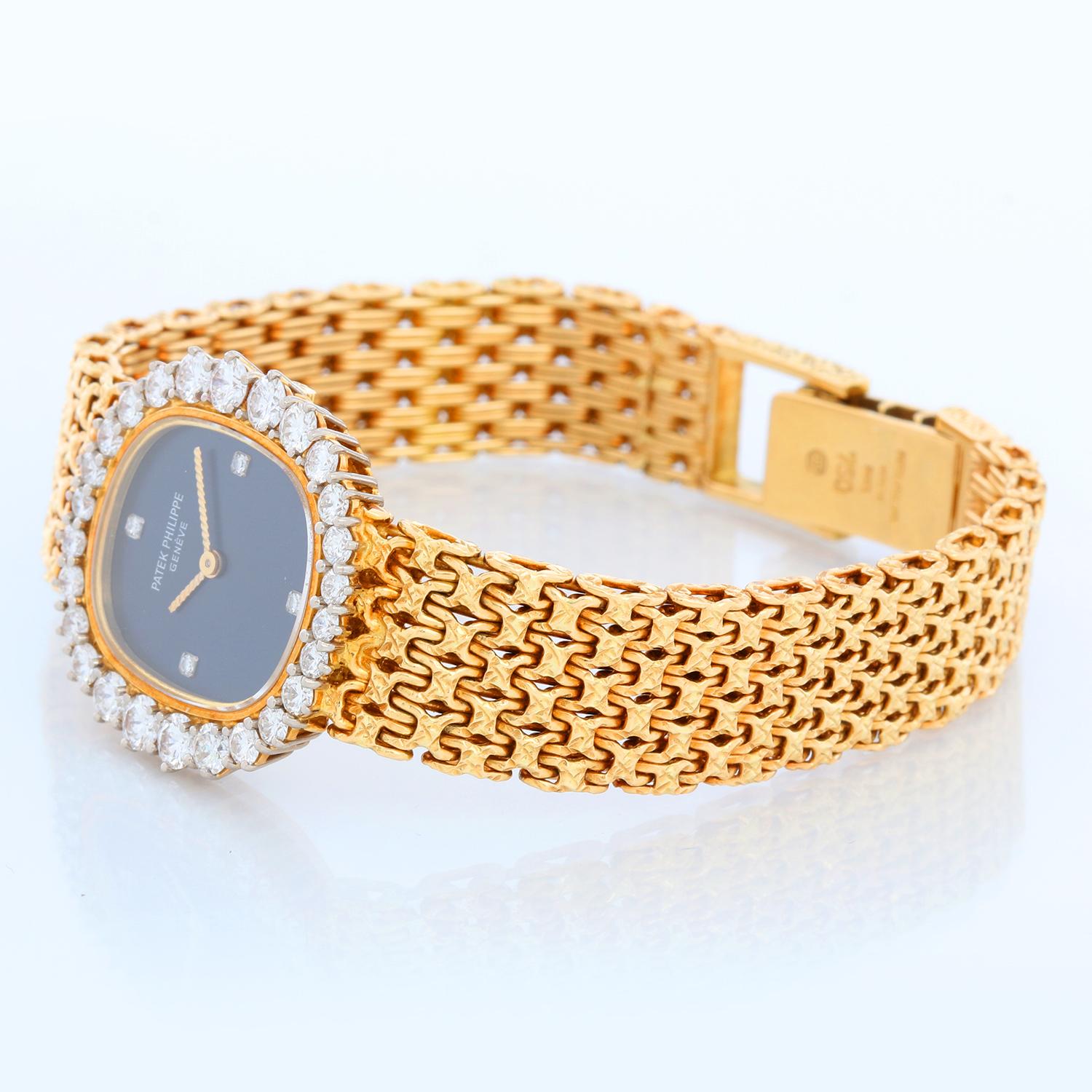 Patek Philippe Ellipse 4137 Diamond Bezel Ladies Gold Watch - Manual winding . 18k yellow gold case (25mm) with factory diamond bezel. Blue dial with factory diamond hour markers.. 18k yellow gold Patek bracelet with locking clasp; will fit up to a