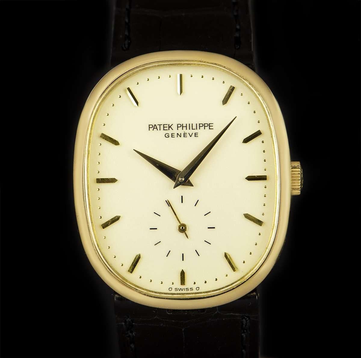 An 18k Yellow Gold 27mm Ellipse Vintage Men's Wristwatch, cream enamel dial with applied hour markers, small seconds at 6 0'clock, a fixed 18k yellow gold bezel, a brand new original black leather strap with an original 18k yellow gold pin buckle,