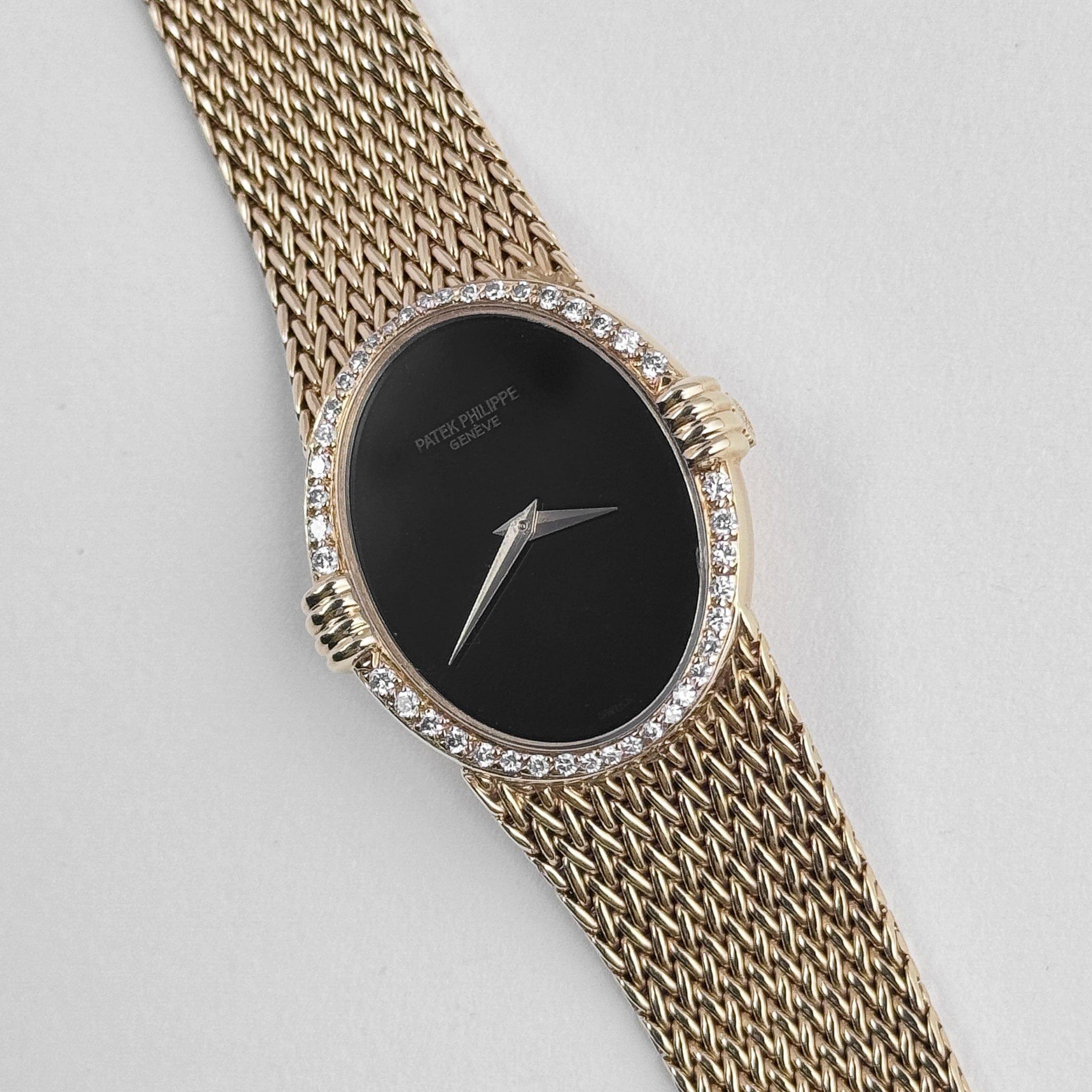 Round Cut Patek Philippe Ellipse Vintage Yellow Gold Black Onyx Dial Diamond Bezel For Sale