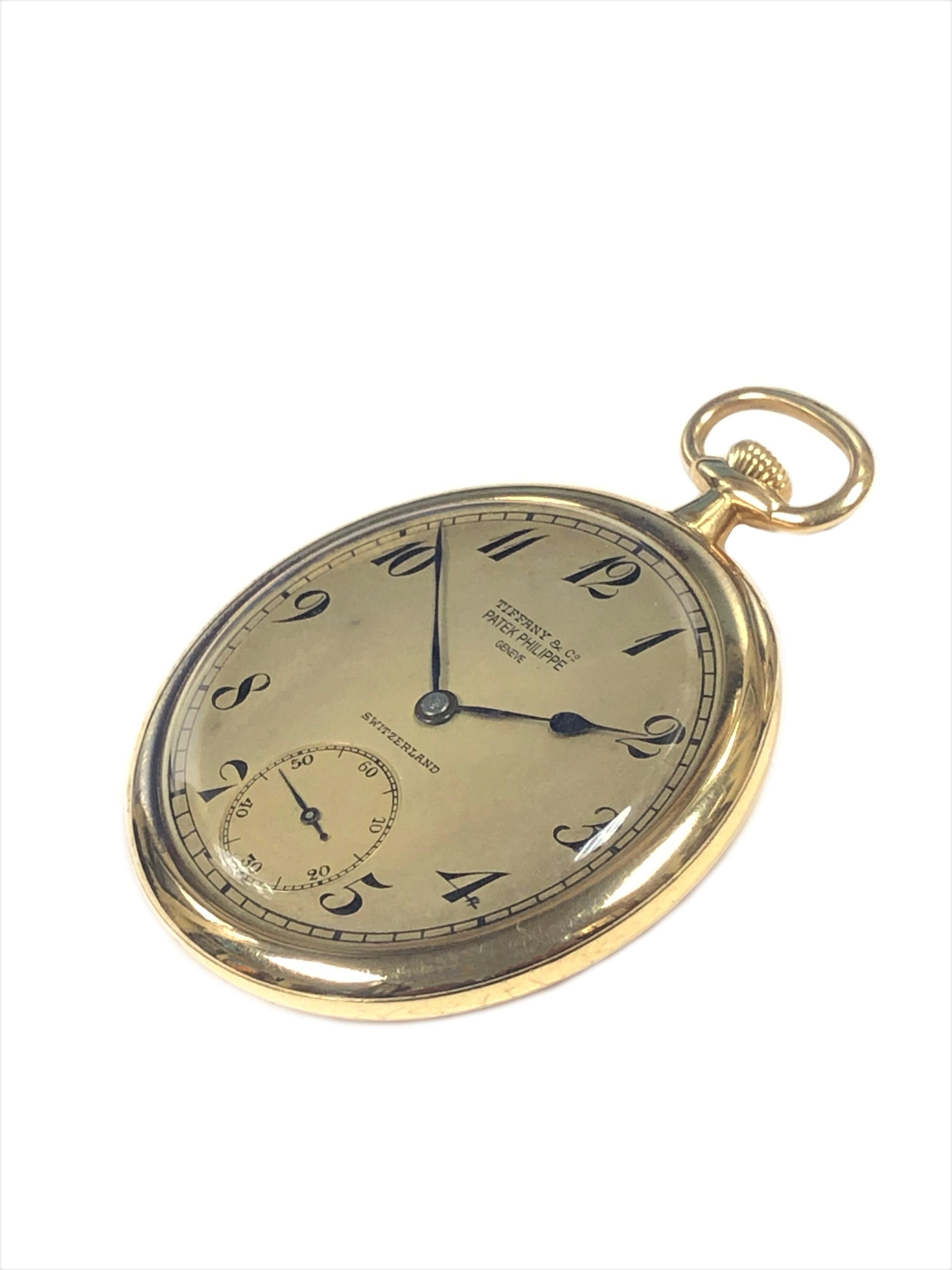Circa 1920s Patek Philippe for Tiffany & Company pocket watch, 18K Yellow Gold 45 M.M. 3 piece case, signed Patek Philippe and Tiffany & Company. 18 Jewel Manual wind mechanical nickle lever movement signed Patek Philippe and Tiffany & Company, both