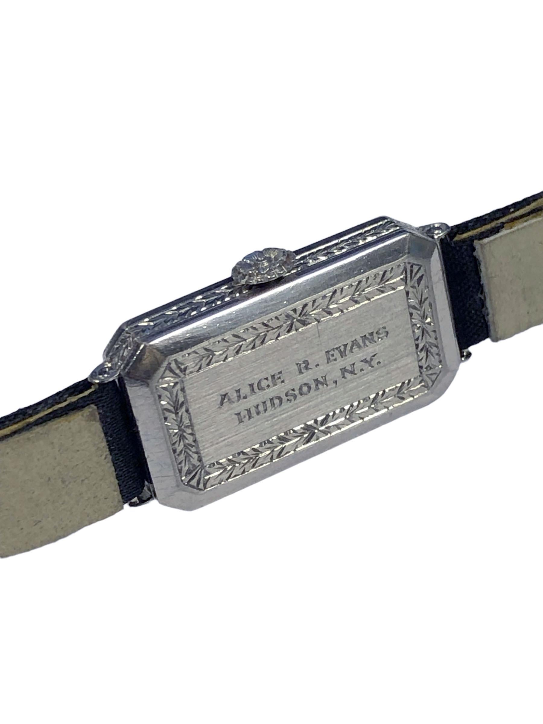 Circa 1920s Patek Philippe for Tiffany & Company Ladies Wrist Watch, 26 X 9 M.M. 2 Piece Platinum Case set with European cut Diamonds totaling 1 Carat, the case sides and back are further decorated with Hand Engraving design work, original platinum