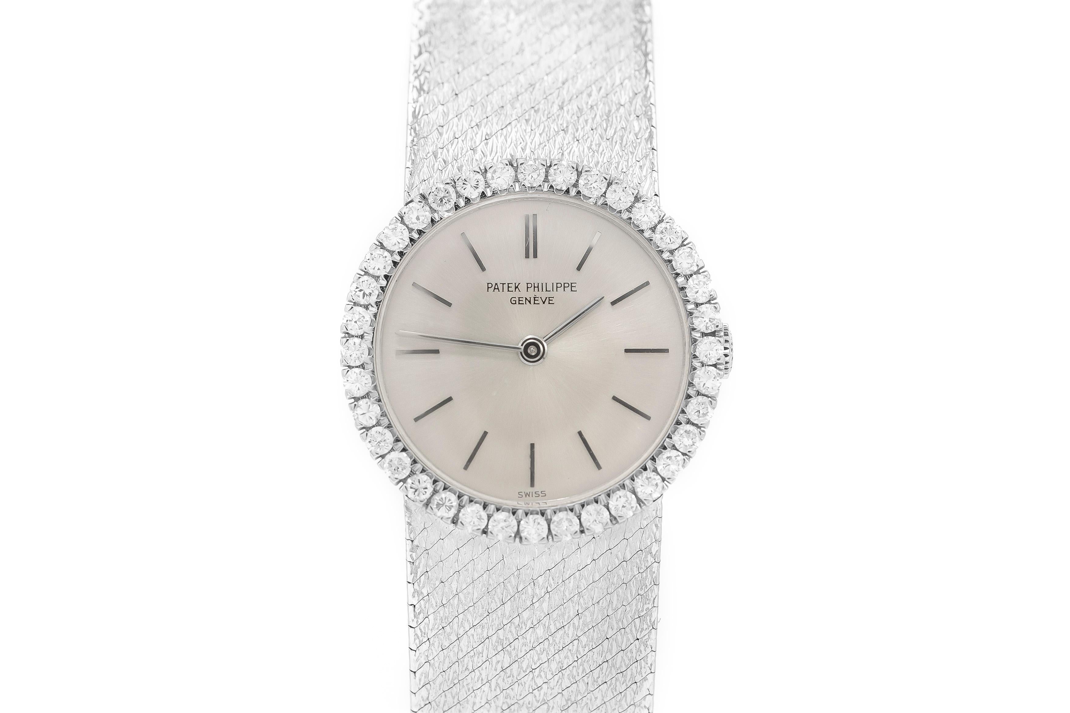 Beautiful Patek Philippe watch is finely crafted in 18K white gold. 
Diamonds on the face of the watch weigh 1.80ct.

