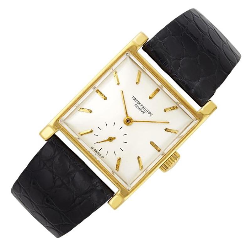 An Elegant Patek Philippe Gold Wristwatch, Ref. 2446
18 kt., mechanical, centering a square silver-tone dial with applied batons and subsidiary seconds, diameter approximately 26 x 26 mm., completed by an aftermarket black crocodile strap with gold