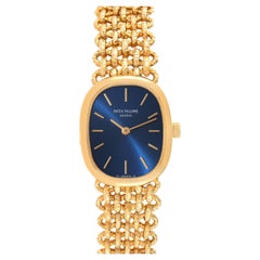 Goldene Ellipse 18k Gelbgold Blaues Zifferblatt Damenuhr von Patek Philippe 4464