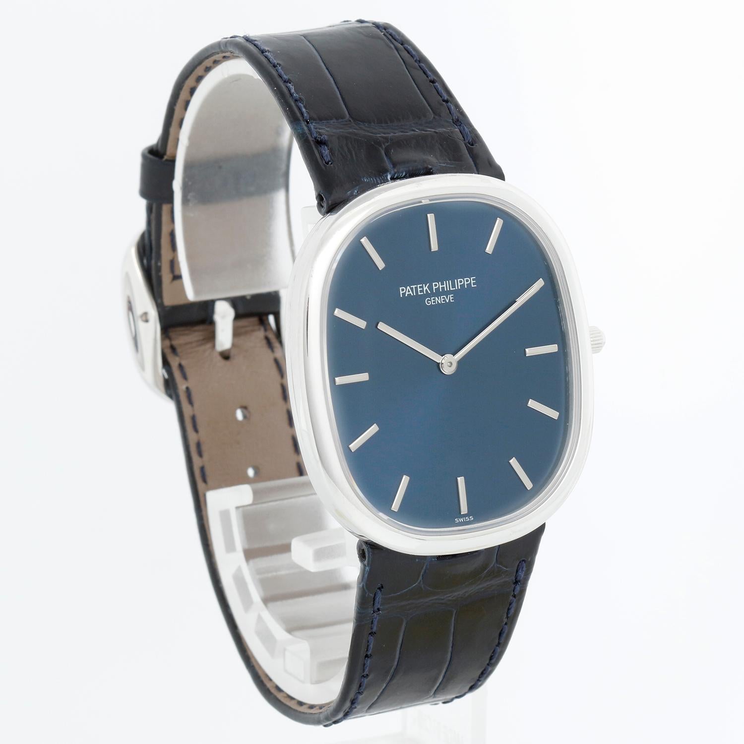 Patek Philippe Golden Ellipse Blue Platinum Men's Watch Ref 5738P-001 - Calibre: 240, Automatic winding. Platinum ultra thin case ( 34 x 39 mm ). Blue sunburst dial with raised gold baton hour markers. Blue Patek Philippe strap with platinum tang