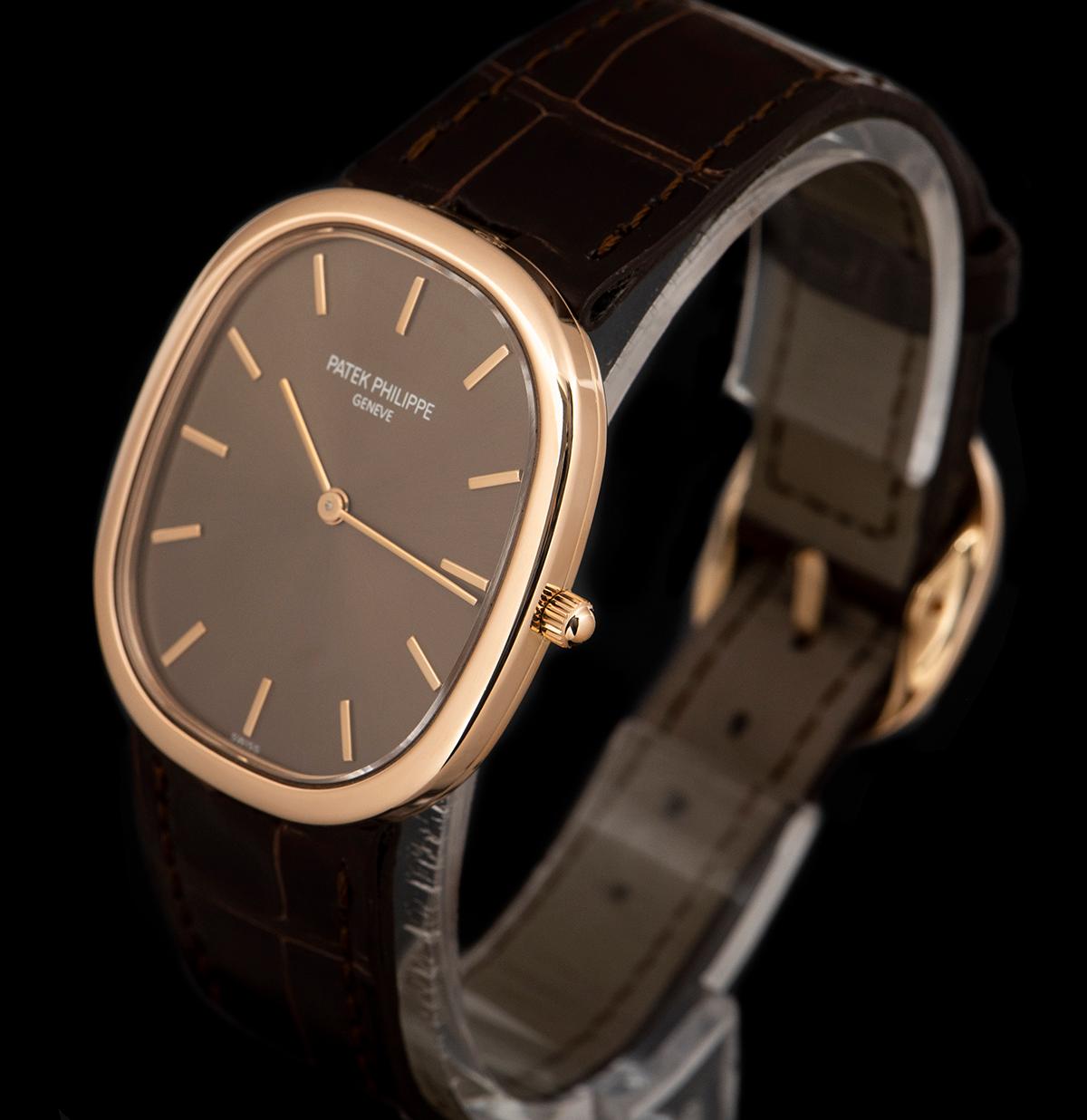 An 18k Rose Gold Golden Ellipse Gents Wristwatch, brown dial with applied hour markers, a fixed 18k rose gold bezel, an original brown leather strap with an original 18k rose gold pin buckle, sapphire glass, automatic movement, in excellent