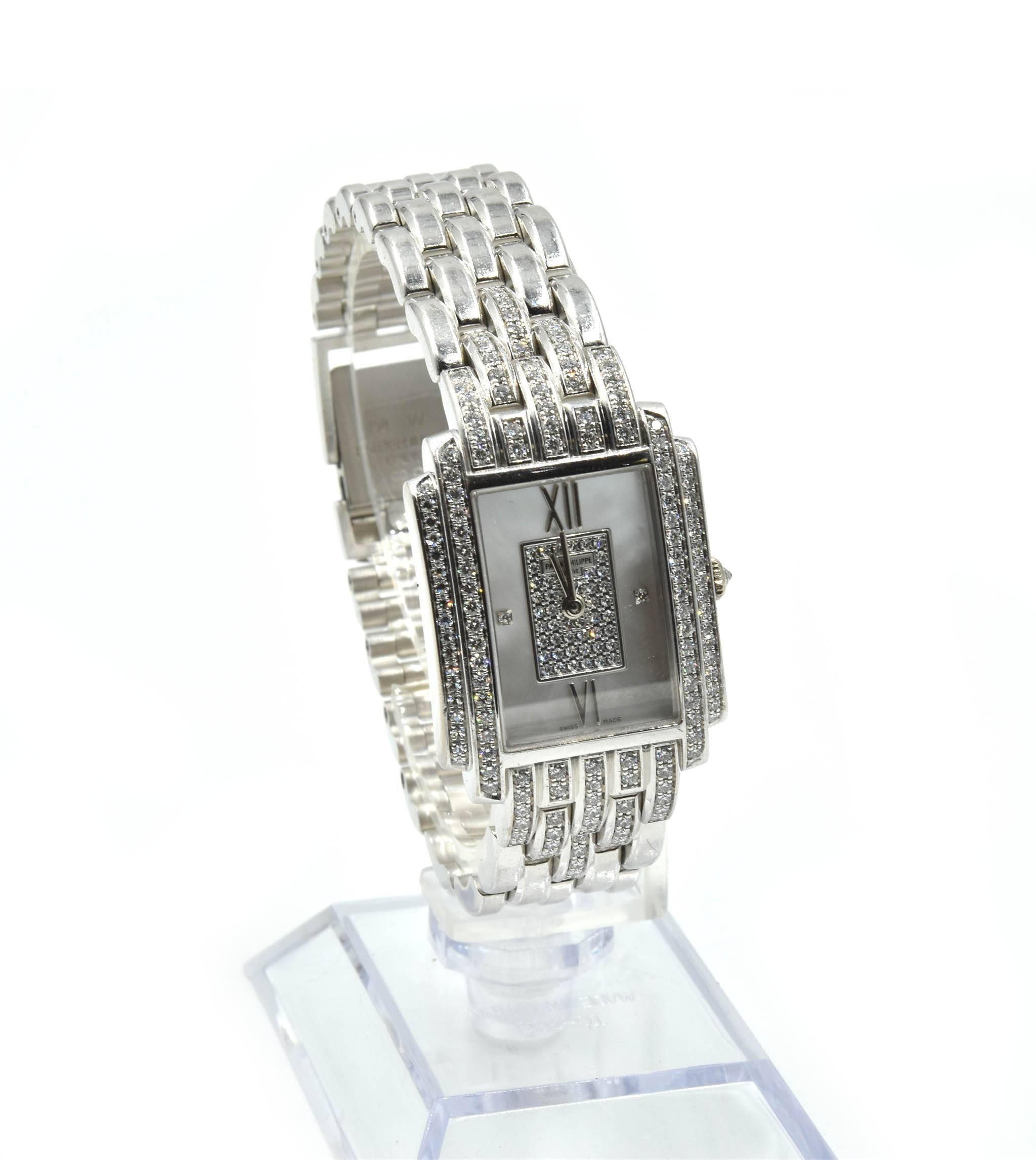 Movement: quartz
Function: hours, minutes
Case: rectangular 23mm x 22mm 18k white gold diamond case, 6mm case thickness, sapphire protective crystal, pull/push crown, water resistant to 30 meters
Band: 18k white gold bracelet set with factory
