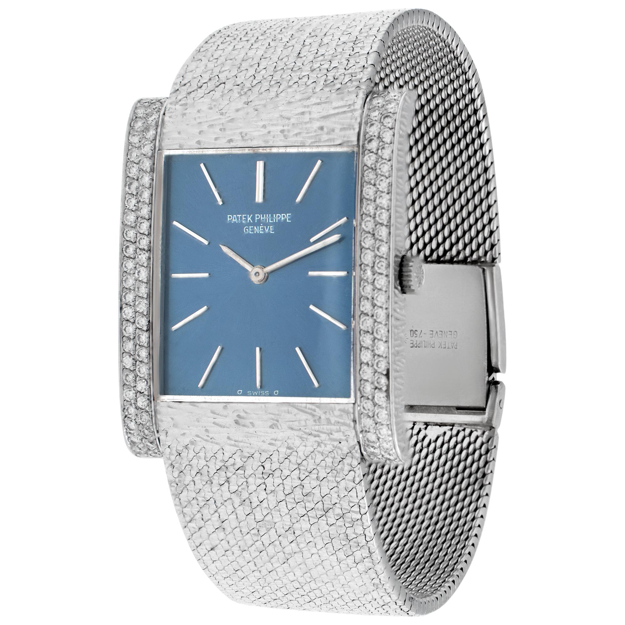 Patek Philippe Gondolo in 18k white gold with double row pave diamond bezel and navy sigma stick dial. Manual. 33 mm length by 26 mm width case size. Will fit a 6.5 to 6.75 inch wrist. Ref 3553-1. Fine Pre-owned Patek Philippe Watch. Certified