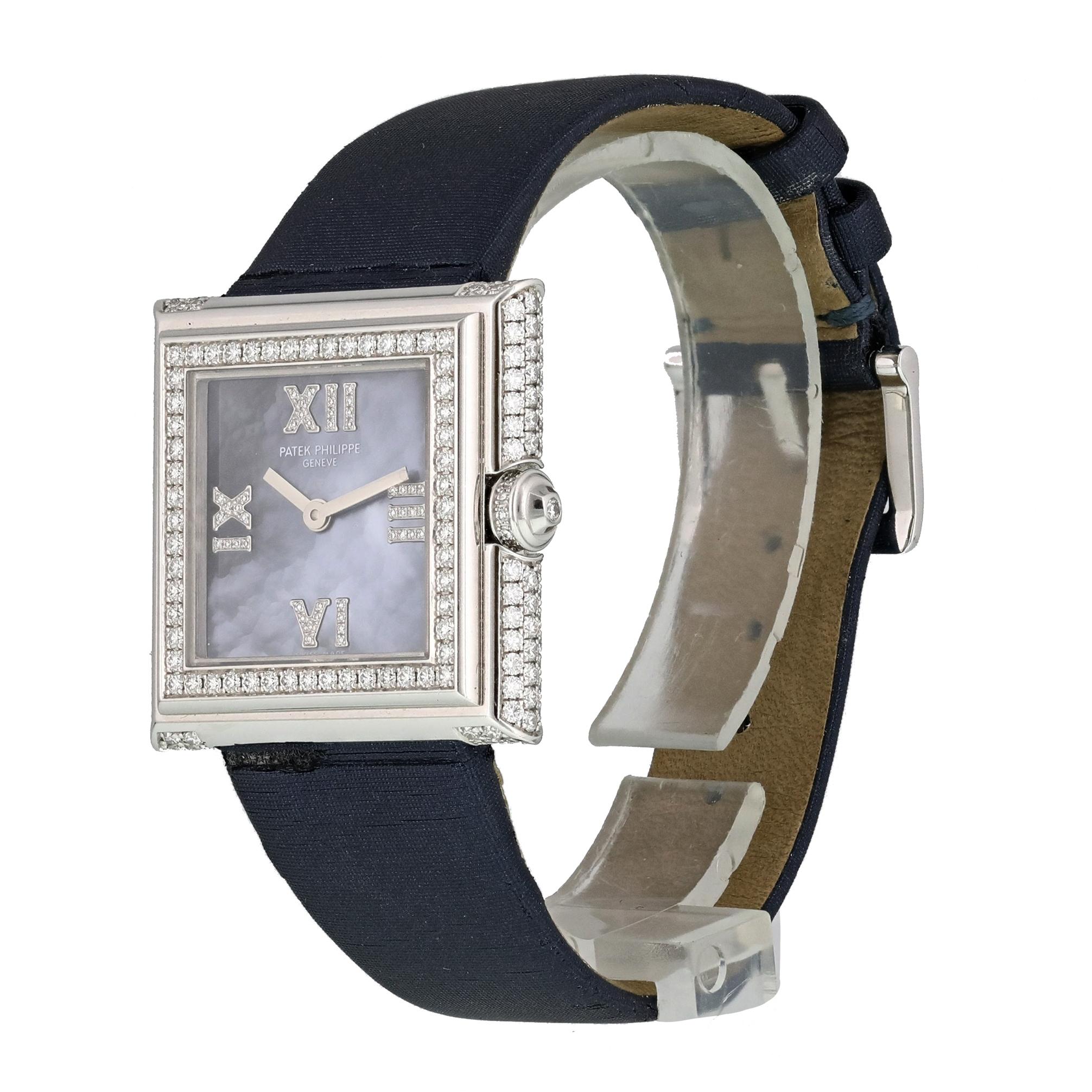 Patek Philippe Gondolo 4869G  Ladies Watch.
28mm 18K White Gold case with Diamonds. 
White Gold Stationary bezel with diamonds. 
Blue Mother-of-Pearl dial with white gold hands and Roman numeral hour markers.
Satin blue Strap with Buckle. 
Will fit