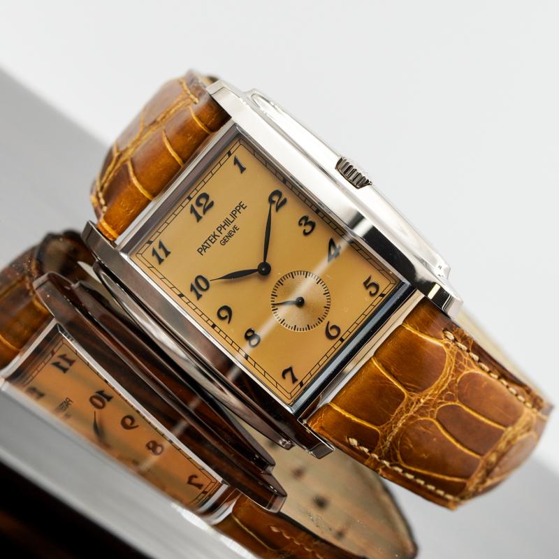 This Patek Philippe Gondolo was recently traded in to the store and is in very good condition. The elegant dress watch features a 34mm x 43mm white gold case holding a brown dial. The watch sits on a brown leather strap with a bit of wear. The