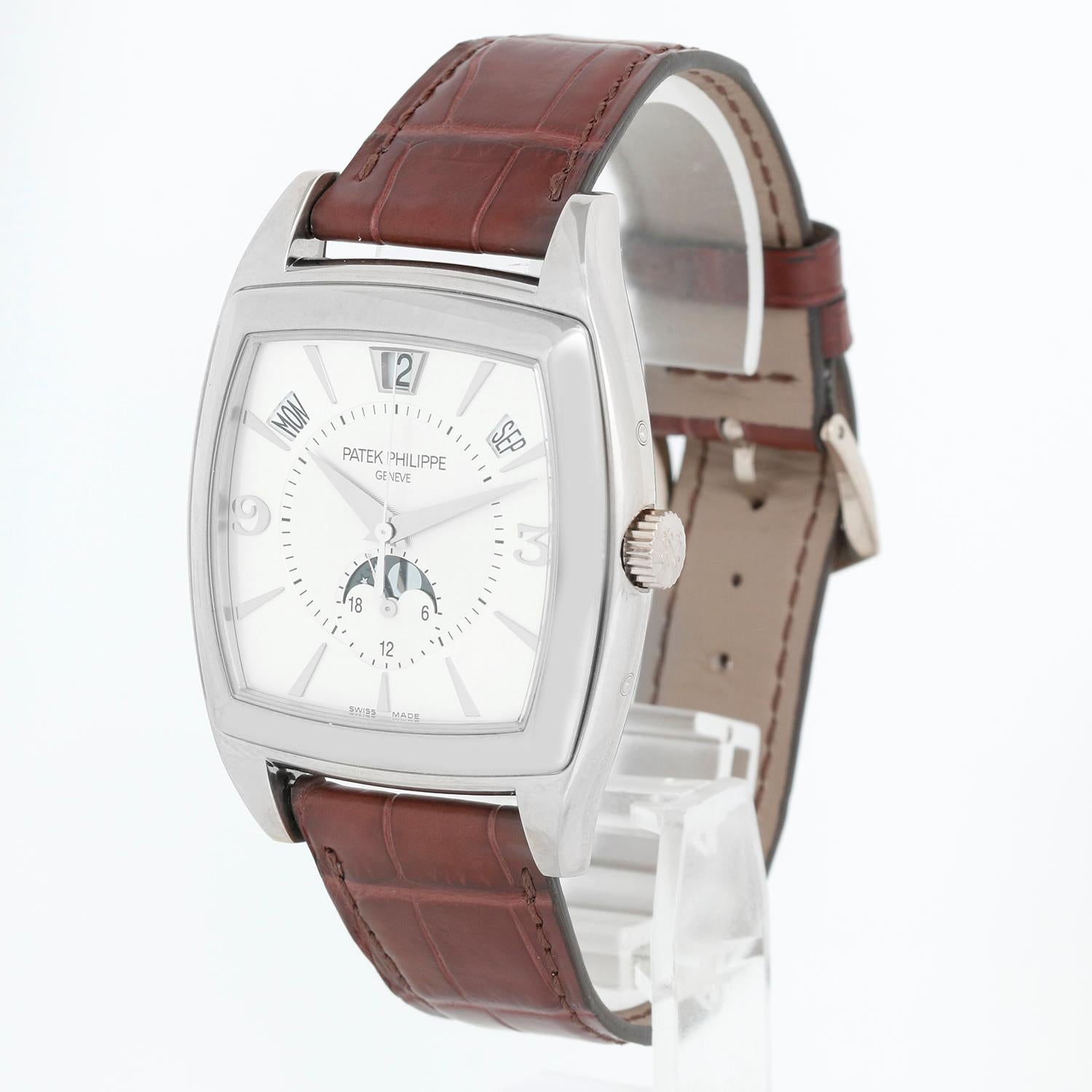 Patek Philippe Gondolo Annular Men's 18k White Gold Watch 5135G - Automatic winding. 18k White gold case with exposition back to view movement (39mm x 51mm). Silver dial with gold markers and Arabic numerals; day, date, month, moonphase and