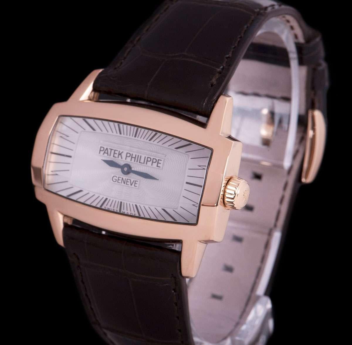 An 18k Rose Gold Gondolo Gemma Ladies Wristwatch, white mother of pearl dial with hour markers, blued steel hands, a fixed 18k rose gold bezel, an original brown leather strap with an original 18k rose gold pin buckle, faceted sapphire glass, quartz
