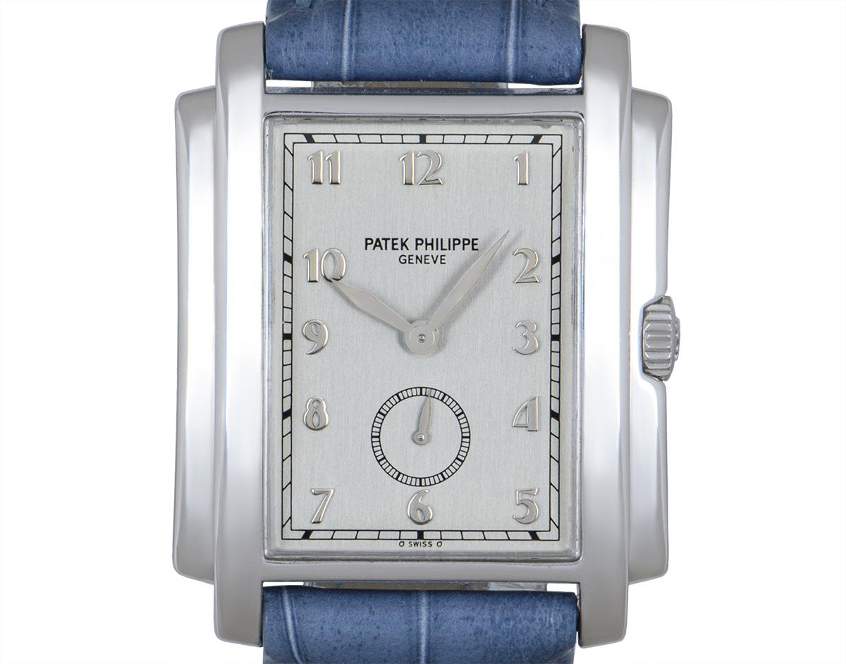 A 30 mm Patek Philippe Gondolo in white gold, featuring a silvered dial with Arabic numbers and small seconds. The brand new original blue leather strap is accompanied by an original white gold pin buckle. Fitted with sapphire crystal and a manual