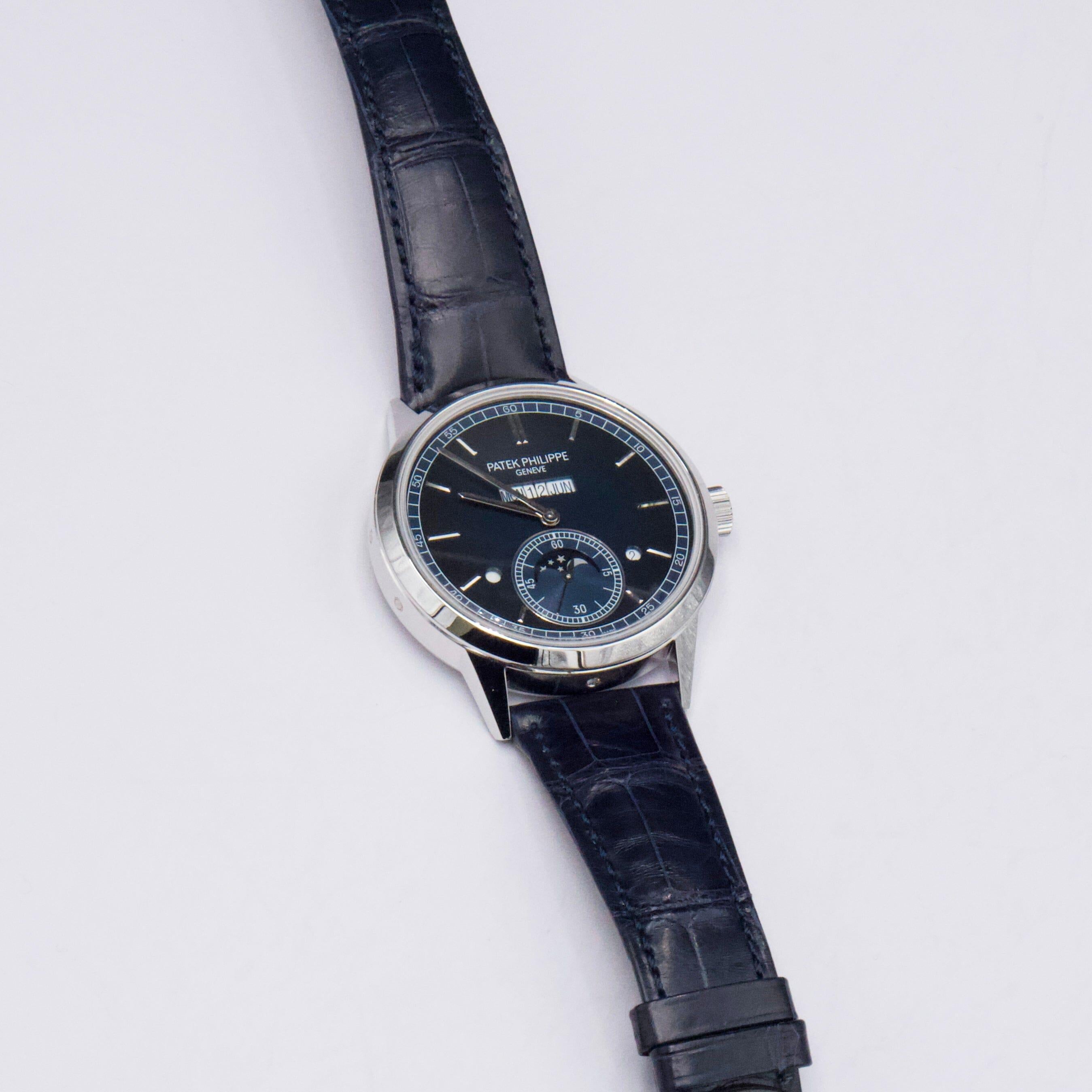 Patek Philippe Complications 5236P-001 Mens Watch. 41.3mm platinum case. Platinum bezel. Blue dial with silver-tone hands and index hour markers. Perpetual calendar displays with a moon phase indicator. Blue leather strap with platinum deployment
