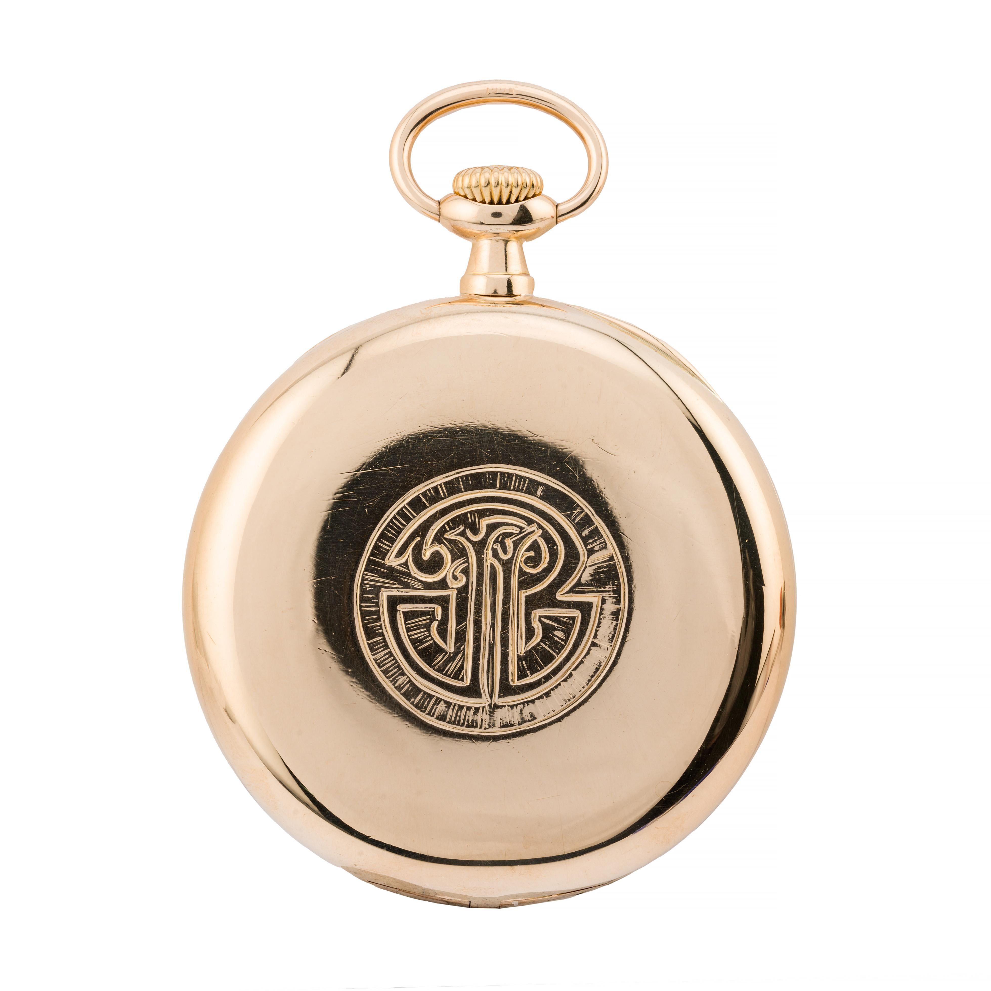 Aston Estate Jewelry Presents:

A distinguished Patek Philippe pocket watch in 18K yellow gold, featuring a classic white enamel dial. The dial is adorned with elegant black roman numerals and intricate, ornate hands, exuding timeless