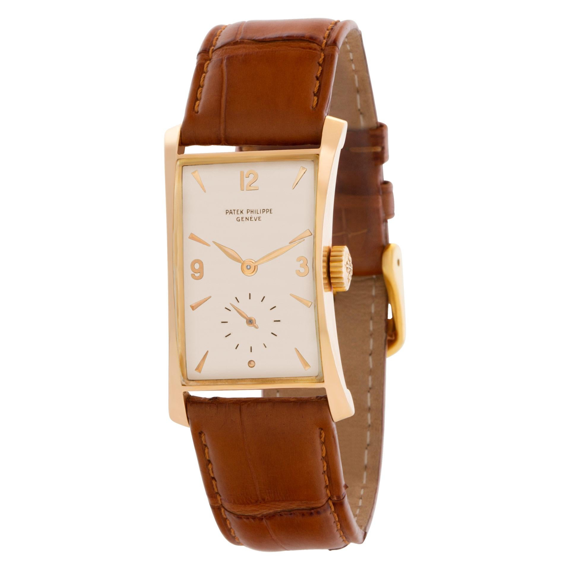 A unique Patek Philippe hourglass with flare lugs, crafted in 18k rose gold and produced in 1957. Originally retailed by Hausmann & Co., an official Patek Philippe dealership in Italy. The case, in our professional opinion, may have been polished,