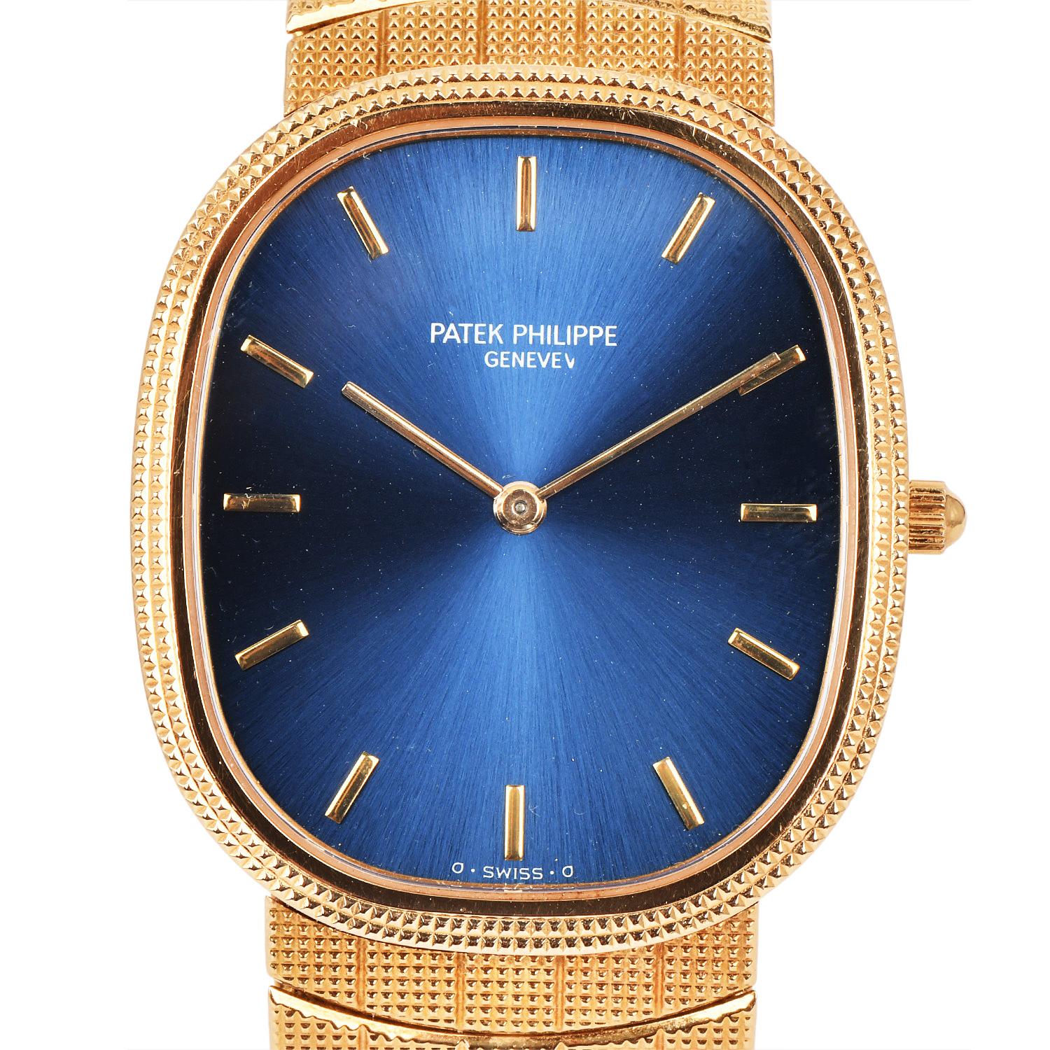Montre homme Patek Philippe Extra Large Golden Automatic Mechanical Ellipse 

Référence 3958. Le boîtier et le bracelet sont en or jaune 18 carats et sont ornés d'une bande de métal.

 bracelet texturé rainuré distinctif en or jaune 18K avec un