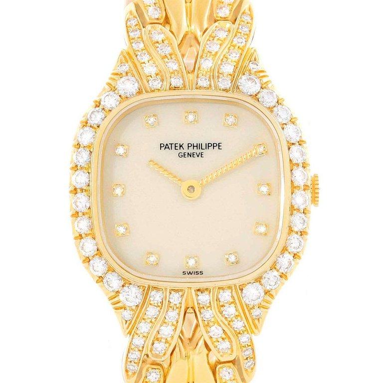 Patek Philippe La Flamme 18k Yellow Gold Diamond Ladies Watch 4715/3. Quartz movement. 18k yellow gold cushion shape case 21 x 23 mm case. Scratch resistant sapphire crystal. White dial with diamond hour markers and twisted batton hands. 18K yellow