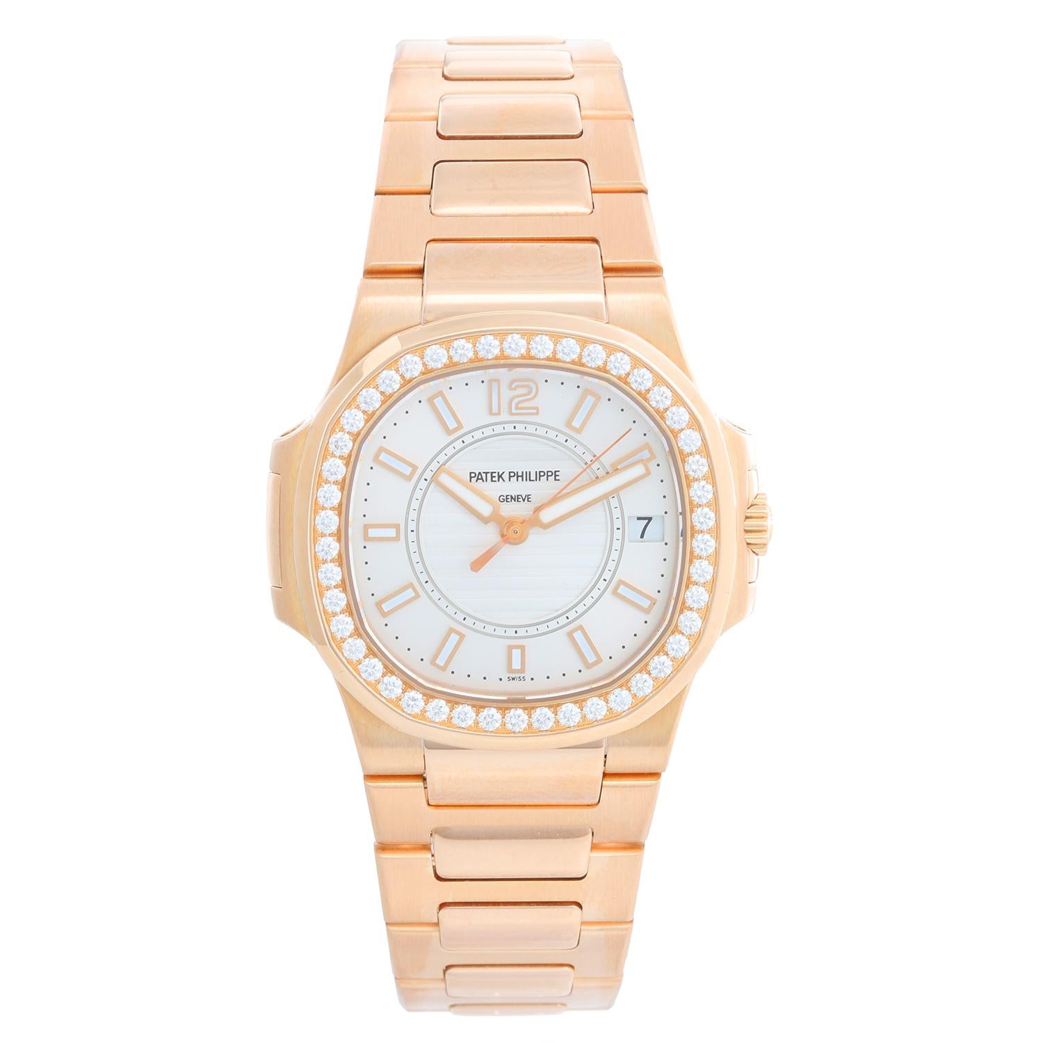 Patek Philippe Ladies 18k Rose Gold Diamond Nautilus 7010/1R - Quartz. 18k rose gold case with diamond bezel. Silver dial with rose gold stick/ luminous markers; date at 3 o'clock. 18k rose gold bracelet with deployant clasp. Pre-owned with Patek