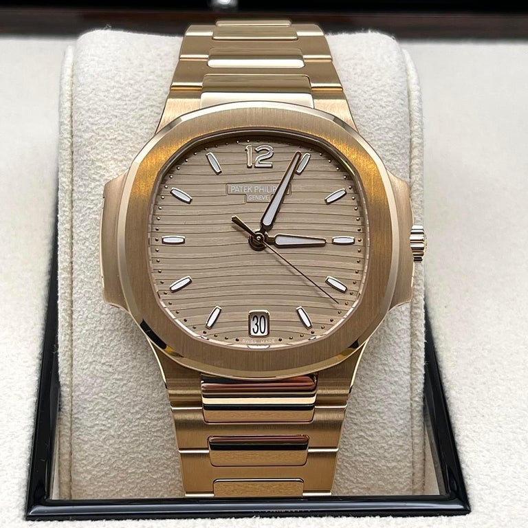 We promise you wont be able to keep your eyes off of the sleek and smooth designs of The Patek Philippe Ladies Nautilus wristwatch. With its round octagonal shape of the satin-finished bezel and 35mm 18k rose gold construction, The Nautilus has