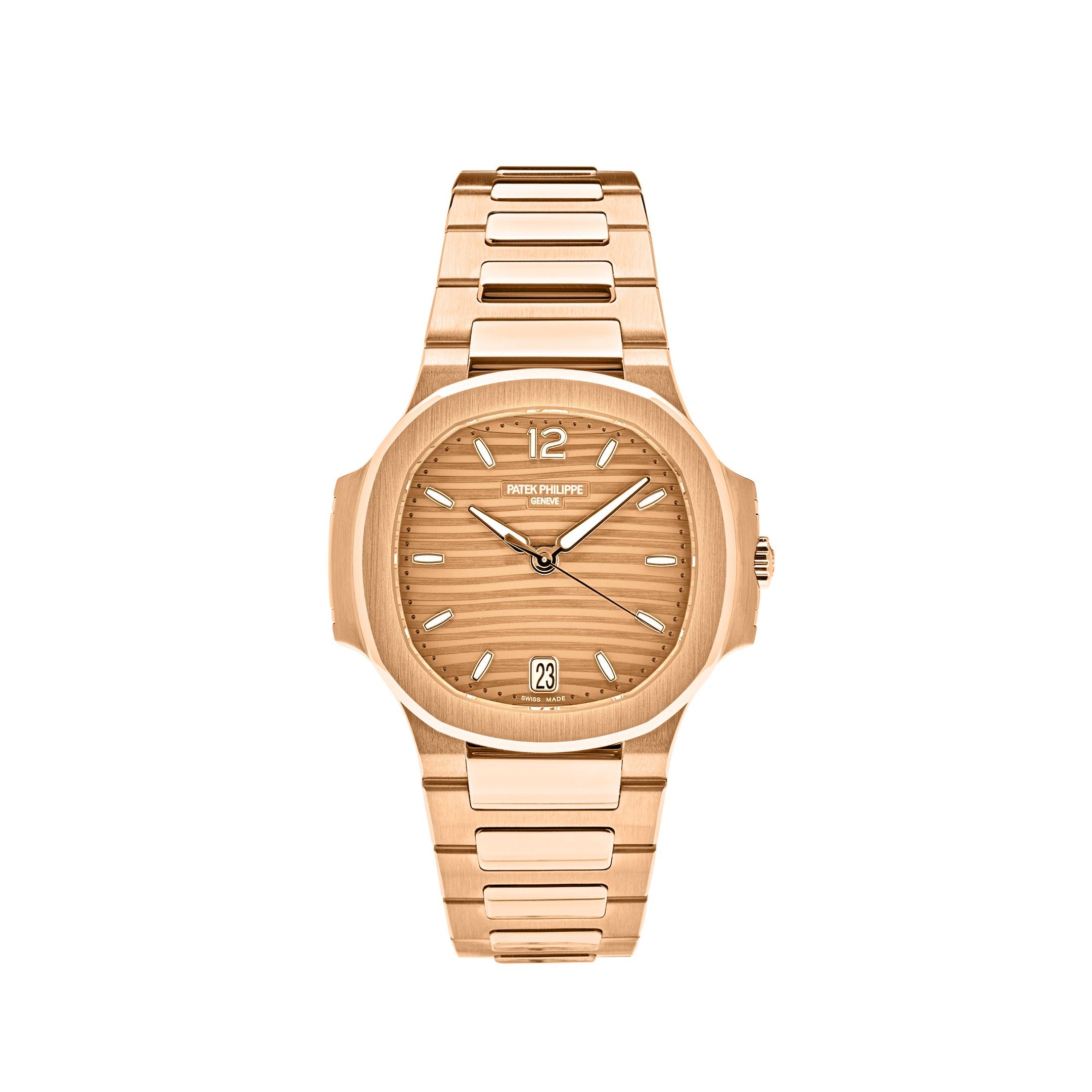 The Patek Philippe Ladies Nautilus features a satin-finished bezel and 35mm 18k rose gold case. In the center, lays a gold embossed dial with luminous applied numerals and hour markers. This beautiful timepiece comes on a rose gold bracelet and