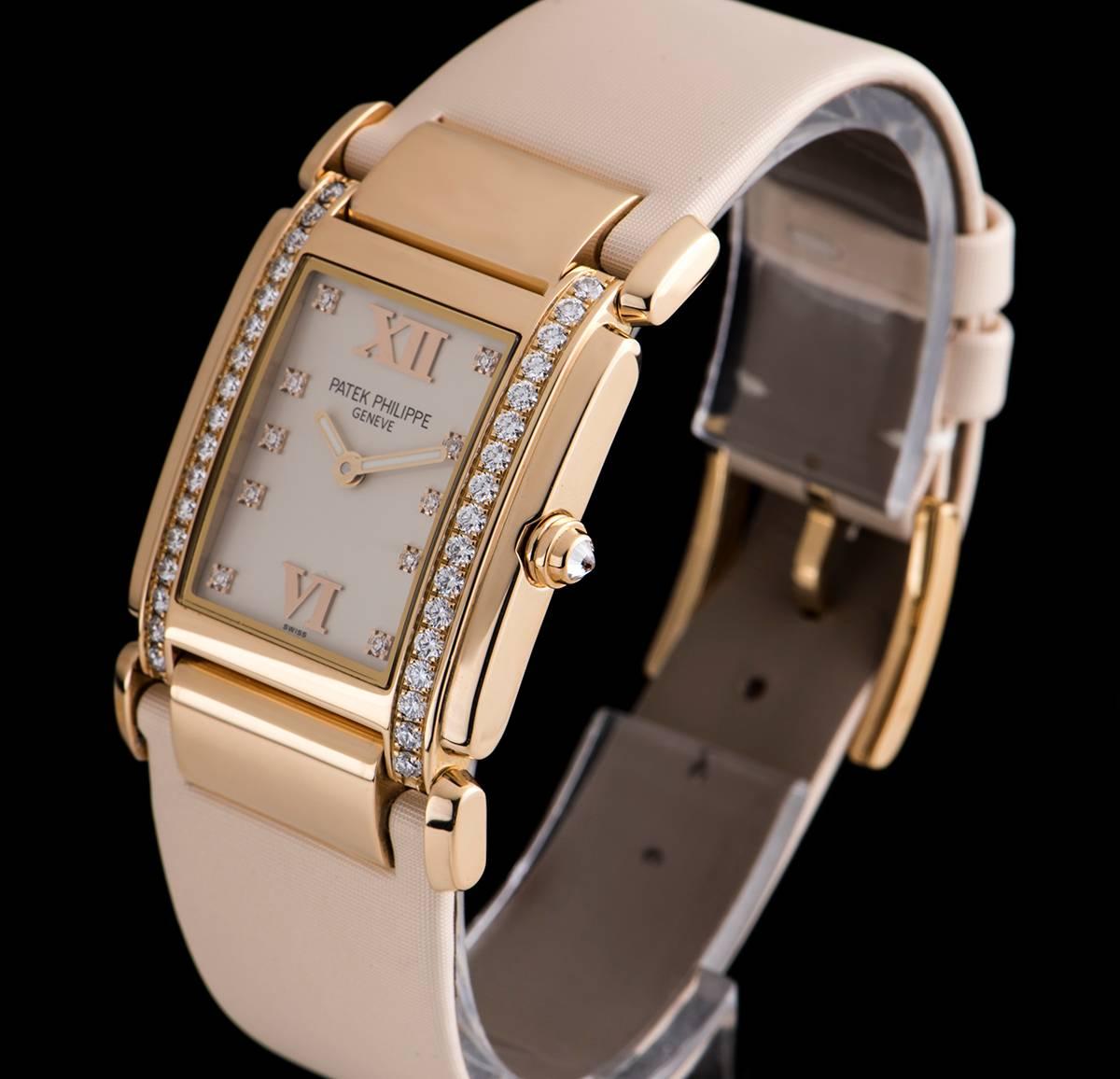 An 18k Rose Gold Twenty-4 Ladies Wristwatch, timeless white dial with 10 applied round brilliant cut diamond hour markers and applied roman numerals 