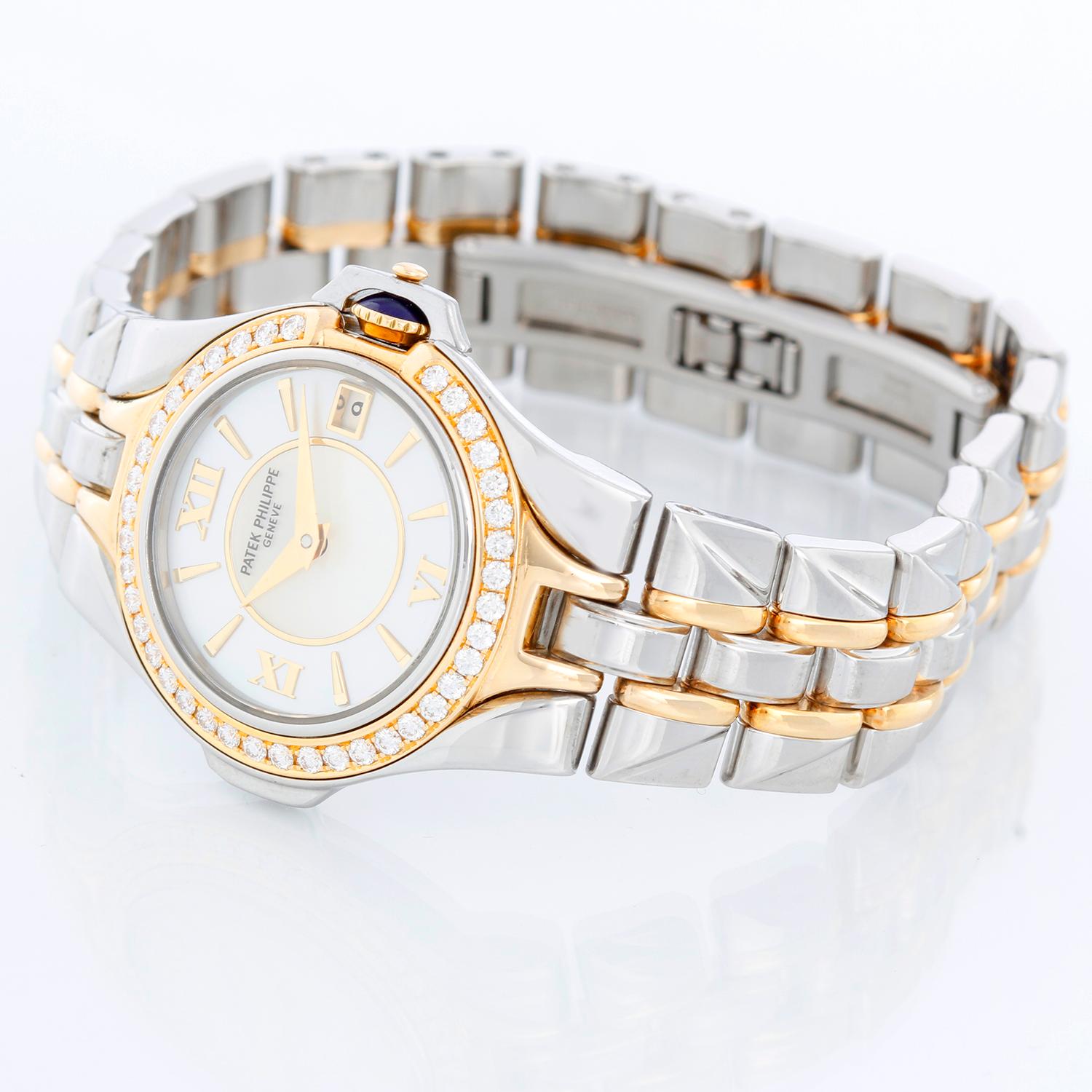 Patek Philippe Ladies Stainless Steel Watch Ladies 4891/1 - Quartz. Stainless steel case & yellow gold with diamond bezel ( 26 mm ) . Mother of Pearl dial with polished hour markers and Roman numerals. Two tone Patek Philippe bracelet with deployant