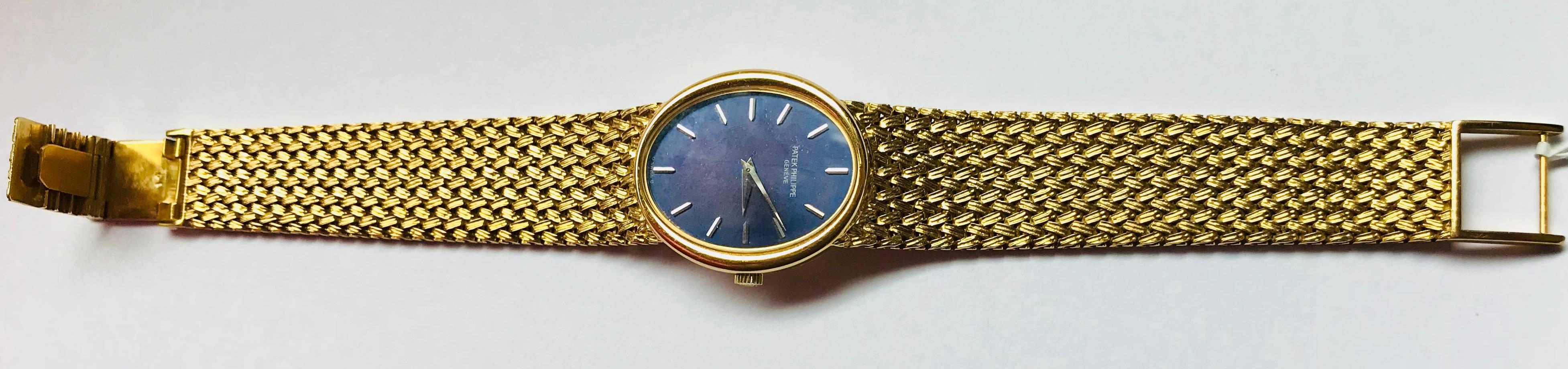 Previously owned Patek Philippe Golden Ellipse Ladies watch. Mint Condition as good as brand new 
yellow gold
Blue dial with applied yellow gold stick hour markers. 
Movement: Manual wind movement. 
yellow gold hours and minute hands. 
yellow gold