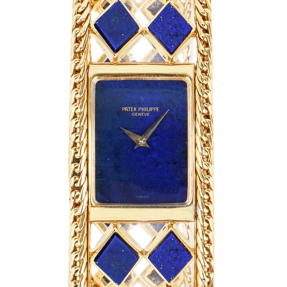 A Rare Yellow Gold Ladies Vintage Wristwatch, lapis lazuli dial, a fixed yellow gold polished bezel, a yellow gold fancy bracelet set with 22 lapiz lazuli panels, a brushed yellow gold jewellery style clasp, sapphire glass, manual wind movement, in