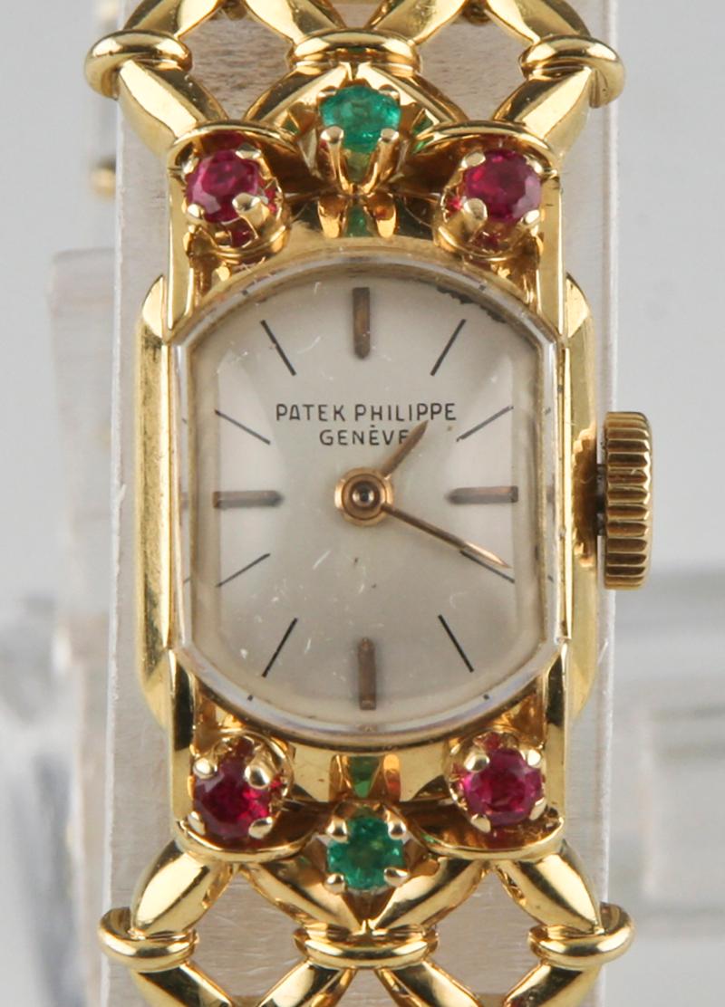 Round Cut Patek Philippe Ladies Yellow Gold Ornate Gubelin Band Manual Wristwatch For Sale