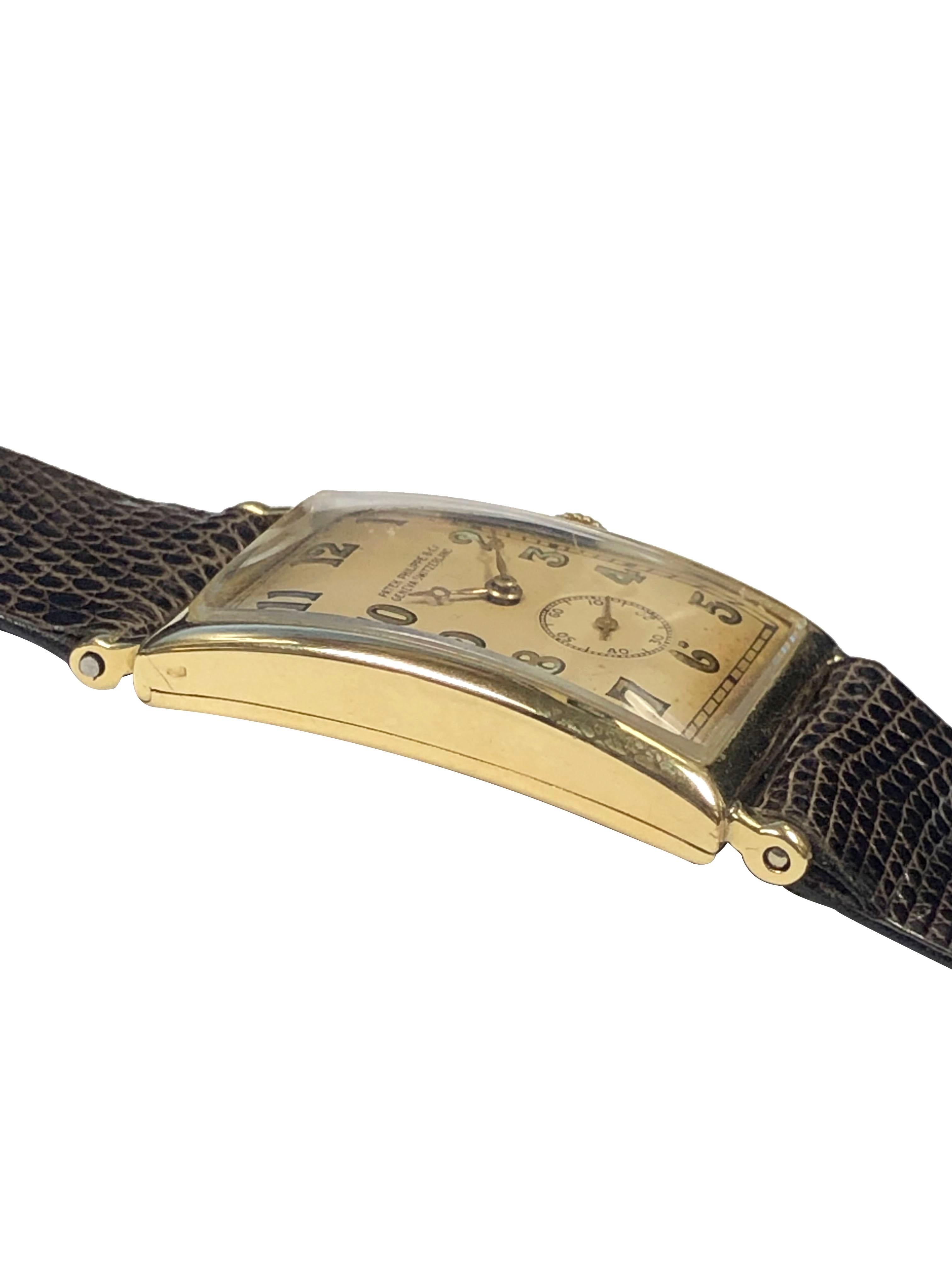 Circa 1920s Patek Philippe Reference 10 Wrist Watch, 33 x 23 M.M. slightly curved 2 piece hinged back case.  18 Jewel Mechanical, manual wind nickle lever movement. Original off white matt finished dial with applied Arabic numerals, sub seconds