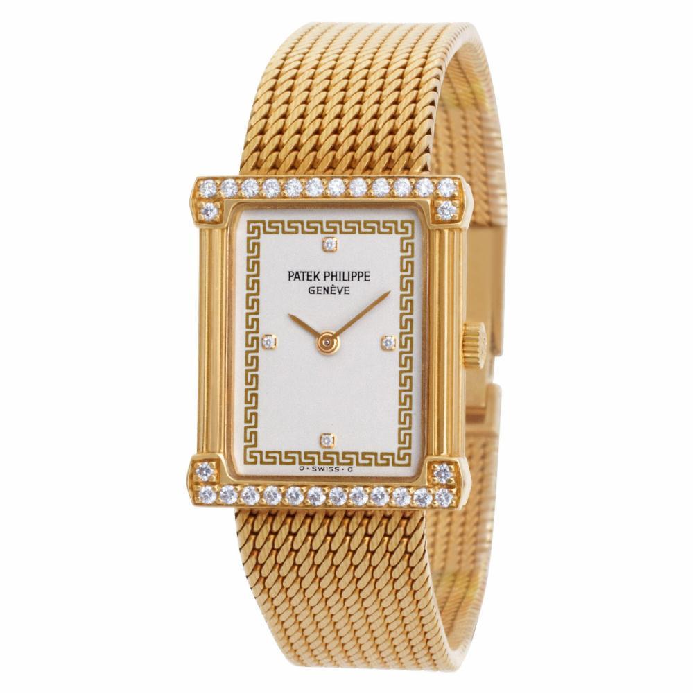 Patek Philippe Les Grecques Reference #: 4632/1. Ladies Patek Philippe Les Grecques in 18k yellow gold with factory diamond case and diamond dial. 18 jewel manual wind movement. With box, papers and a wallet. Length: 6.5 inches. 20 mm x 24.5 mm case