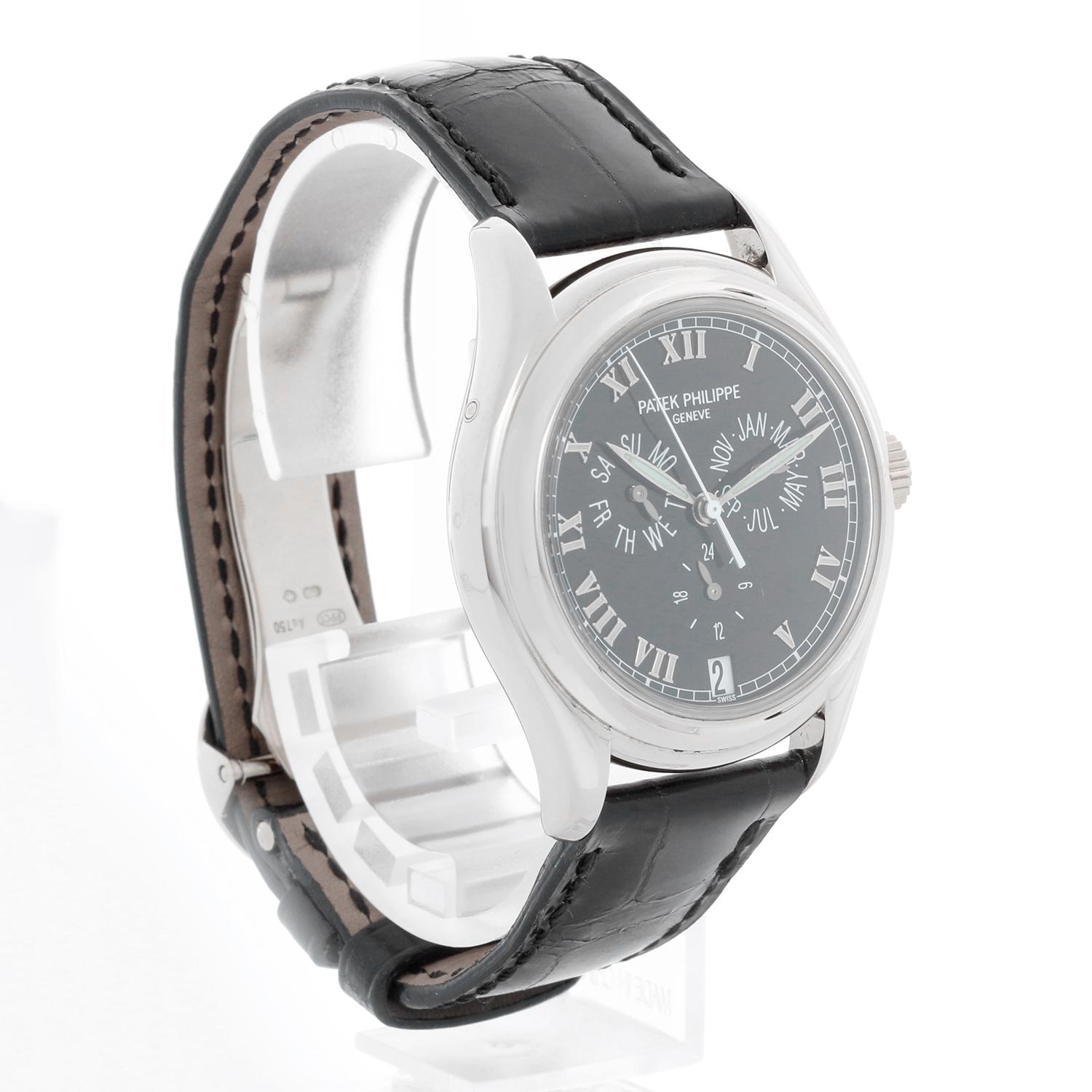 Patek Philippe Men's Annual Calendar White Gold Watch Ref. 5035G - Automatic winding. White Gold case ( 37 mm). Black dial with  hours, minutes, seconds, date, annual calendar, day and month. Black Patek Philippe strap with 18K White gold deployant