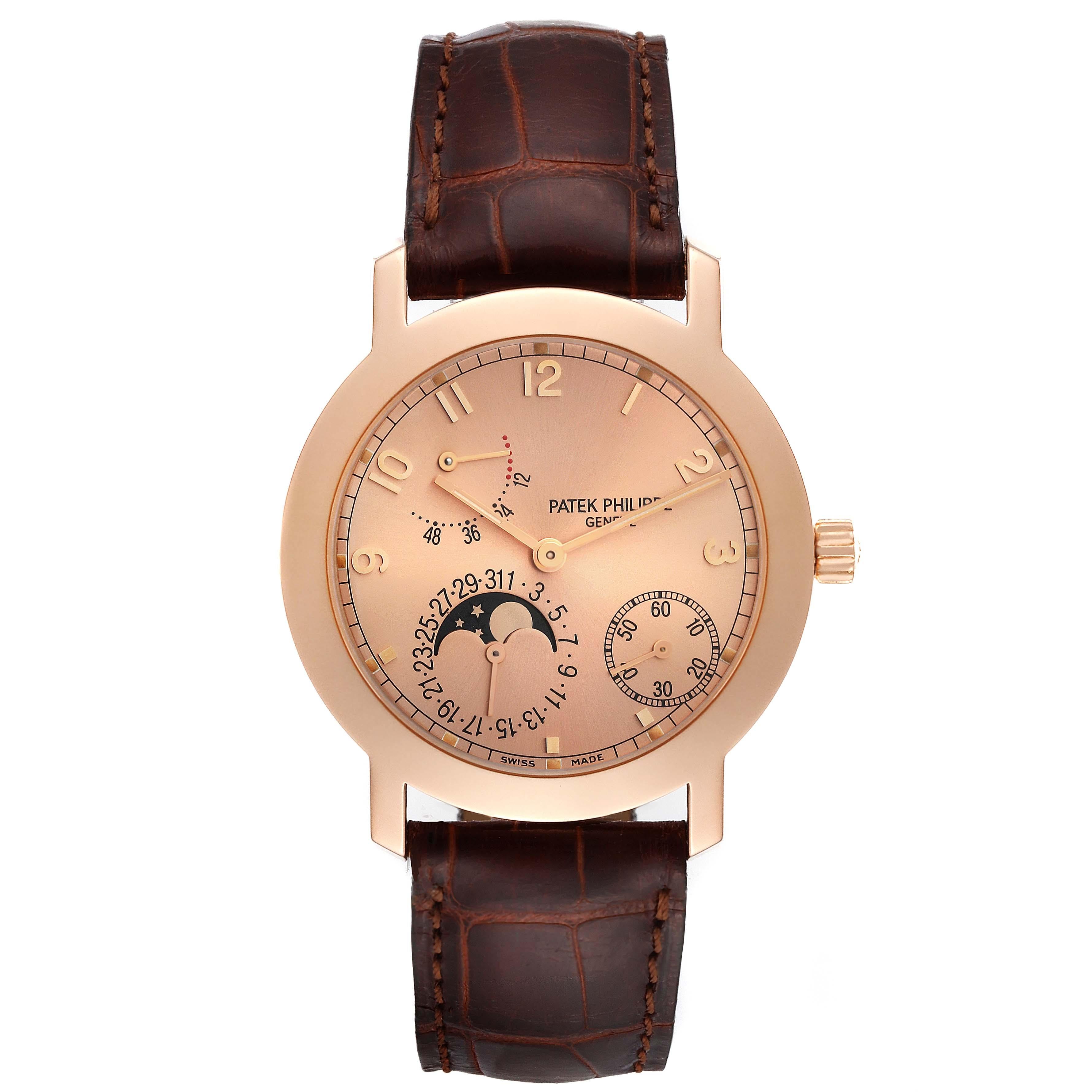 Patek Philippe Moonphase Power Reserve Rose Gold Mens Watch 5055. Automatic self-winding movement. Self-compensating balance spring, solid gold rotor, 48 hour power reserve and engraved with the Geneva Seal. 18K rose gold round case 36.0 mm in