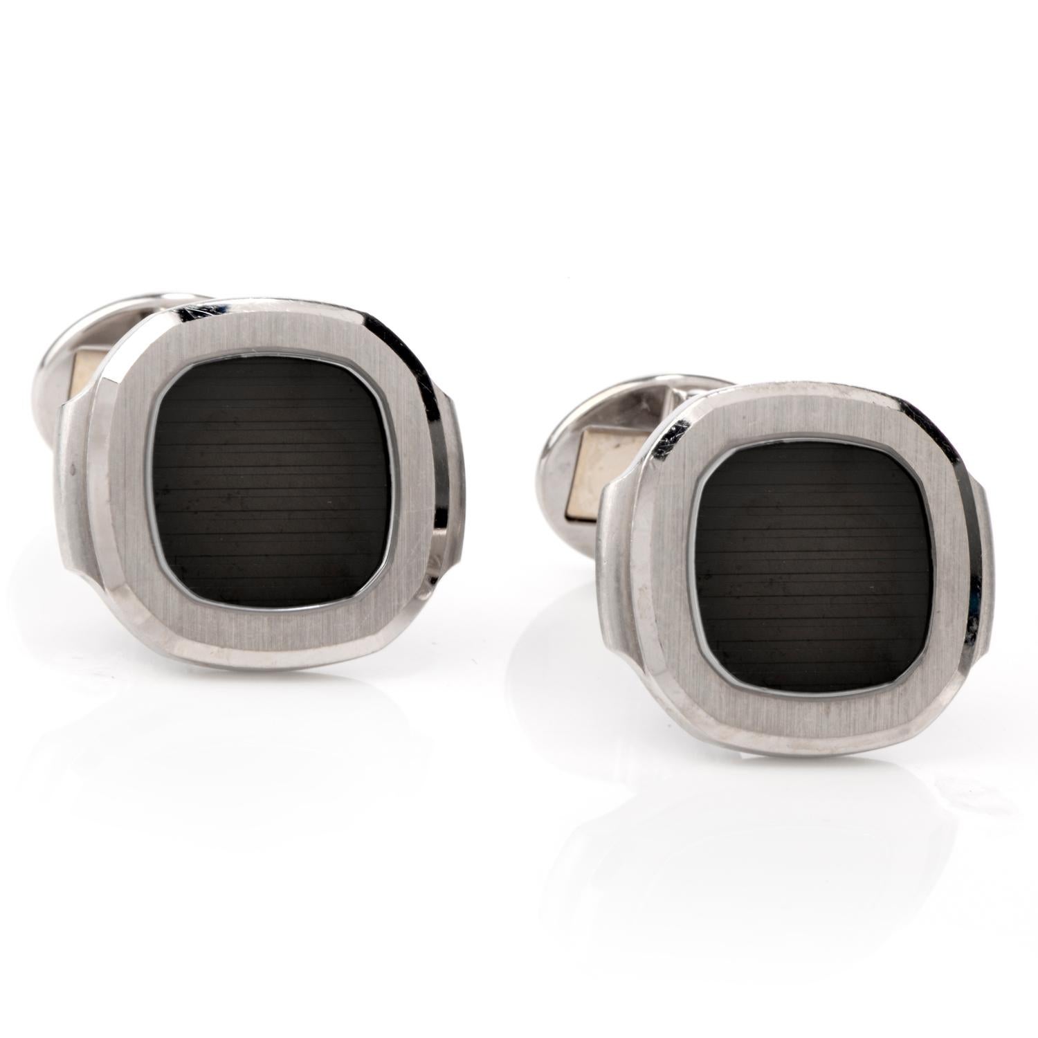 These Patek Phillippe Nautilus cufflinks were crafted in 18K white gold.

For the Nautilus series, these Cuff Links have a Silvery-white center

and sapphire crystal. 

Current manufacturer's retail price is $5560.

Hallmarked and purity