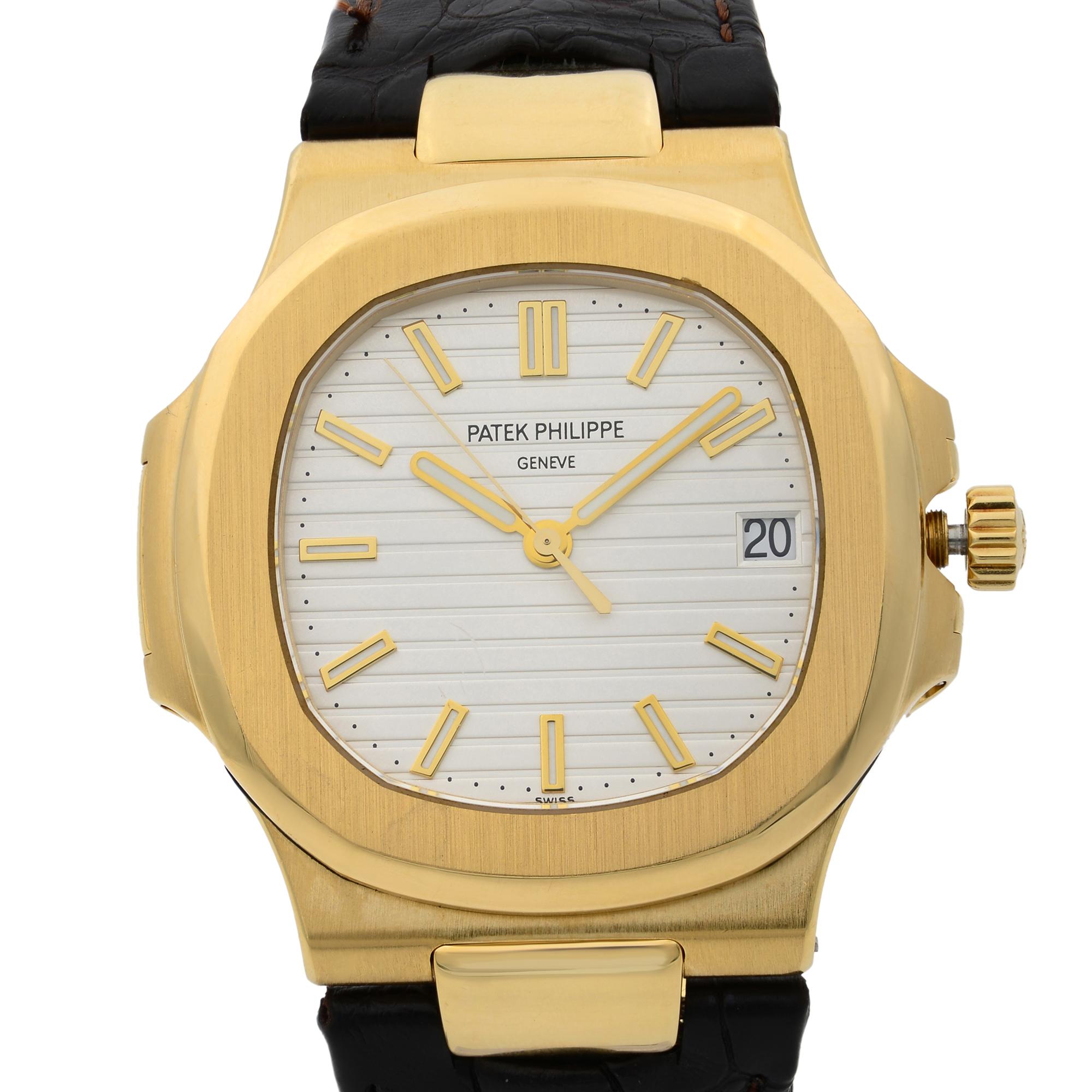 This pre-owned Patek Philippe Nautilus  5711J-001 is a beautiful men's timepiece that is powered by mechanical (automatic) movement which is cased in a yellow gold case. It has a octagonal shape face, date indicator dial and has hand sticks style