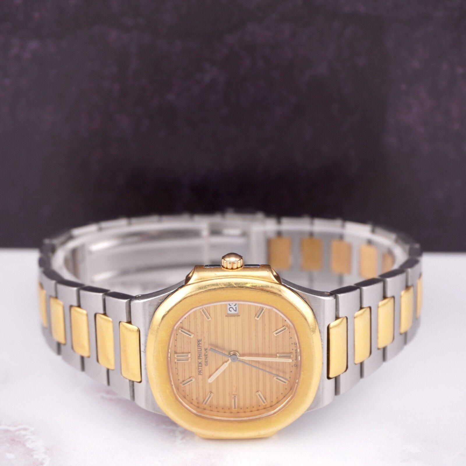 Patek Philippe Nautilus 34mm Gold Dial 18k Yellow Gold & Steel Watch 3900/ 1JA 1
