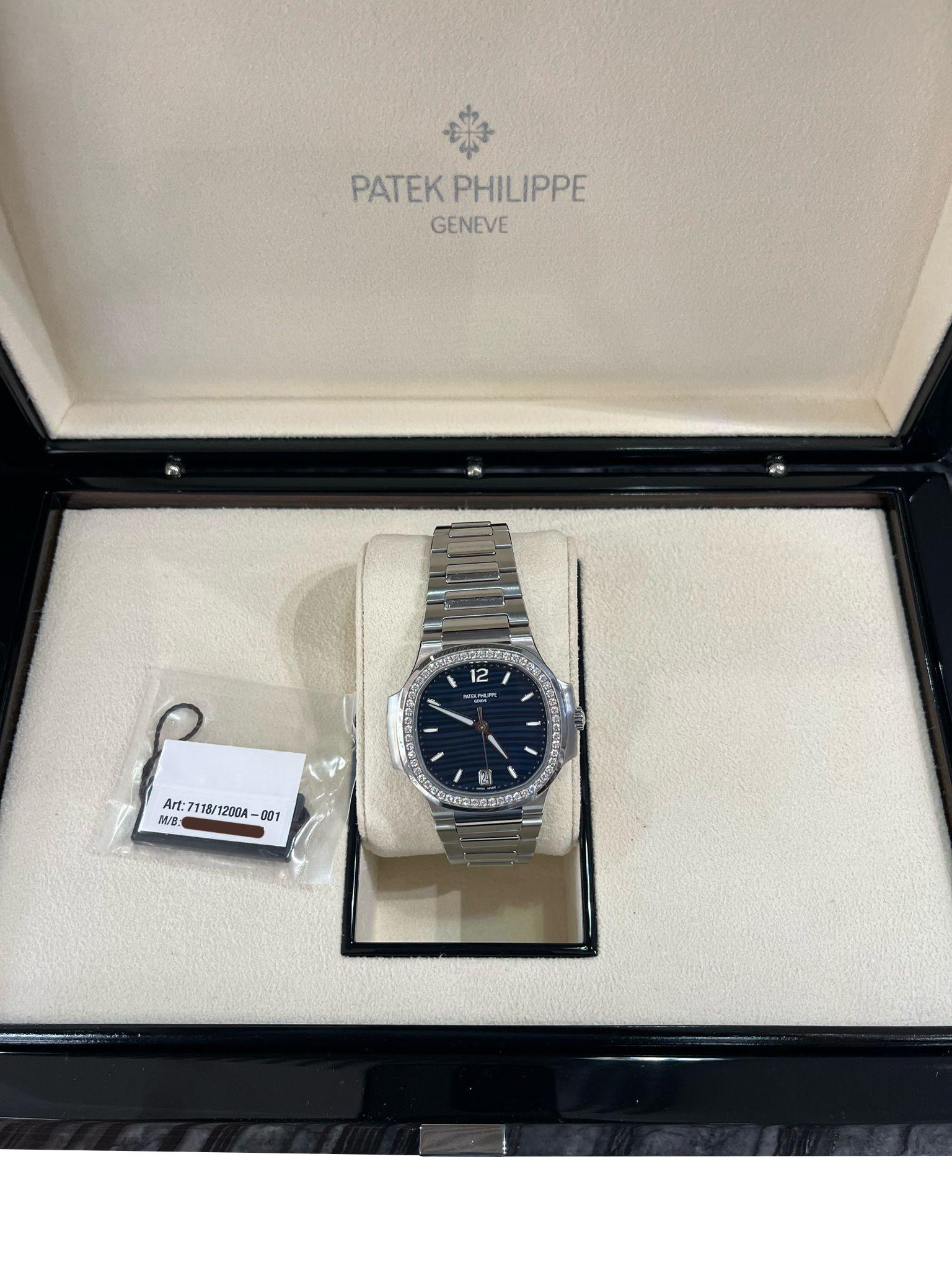 Patek Philippe Nautilus 35.2mm Blue Dial Diamond Bezel Ladies Watch 7118/1200A In New Condition For Sale In Aventura, FL